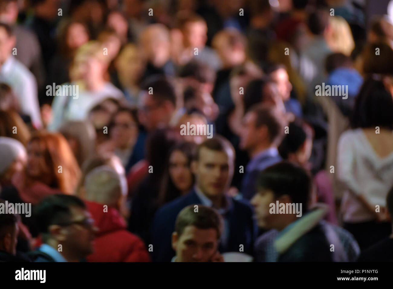 Crowd of walking people walking indoors. Stock Photo