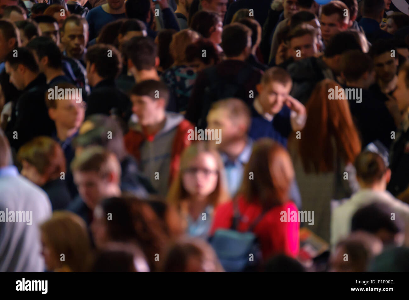 Crowd of walking people walking indoors. Stock Photo