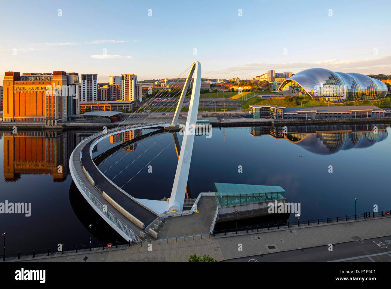 Dawn on Newcastle Quayside looking towards the Tyne Bridges, Newcastle upon Tyne, Tyne & Wear, North East England, United Kingdom Stock Photo