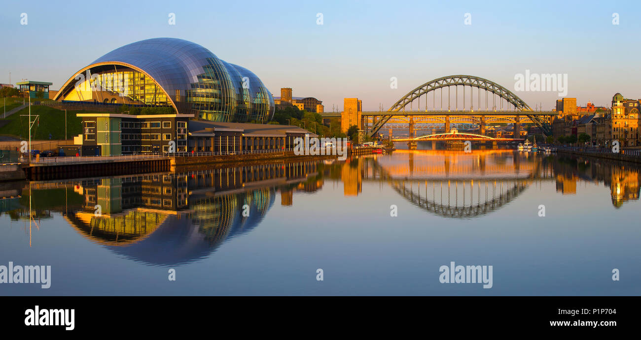 Dawn on Newcastle Quayside looking towards the Tyne Bridges, Newcastle upon Tyne, Tyne & Wear, North East England, United Kingdom Stock Photo