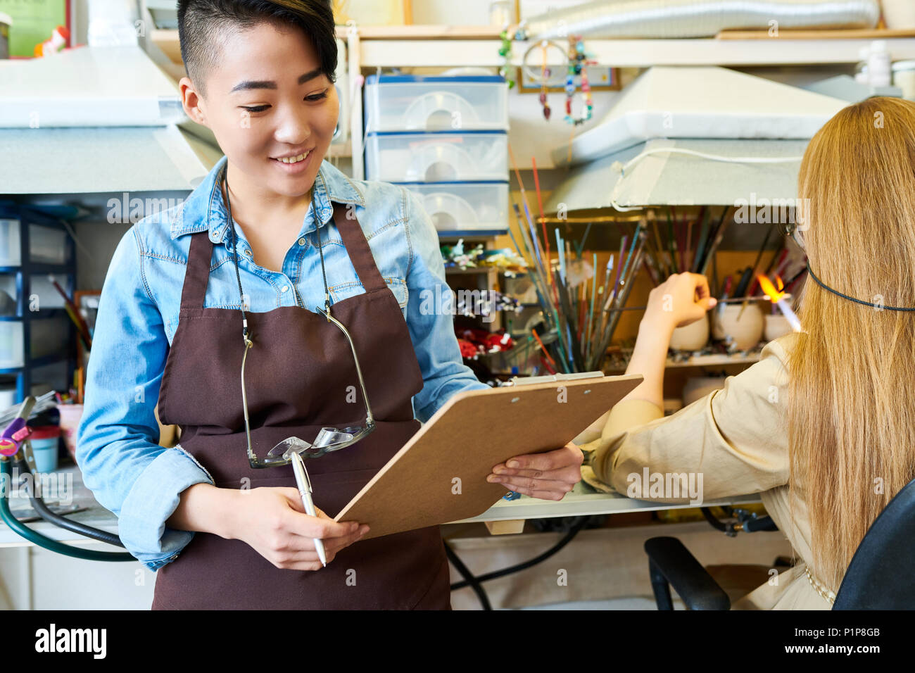 Asian Female Artists in Workshop Stock Photo