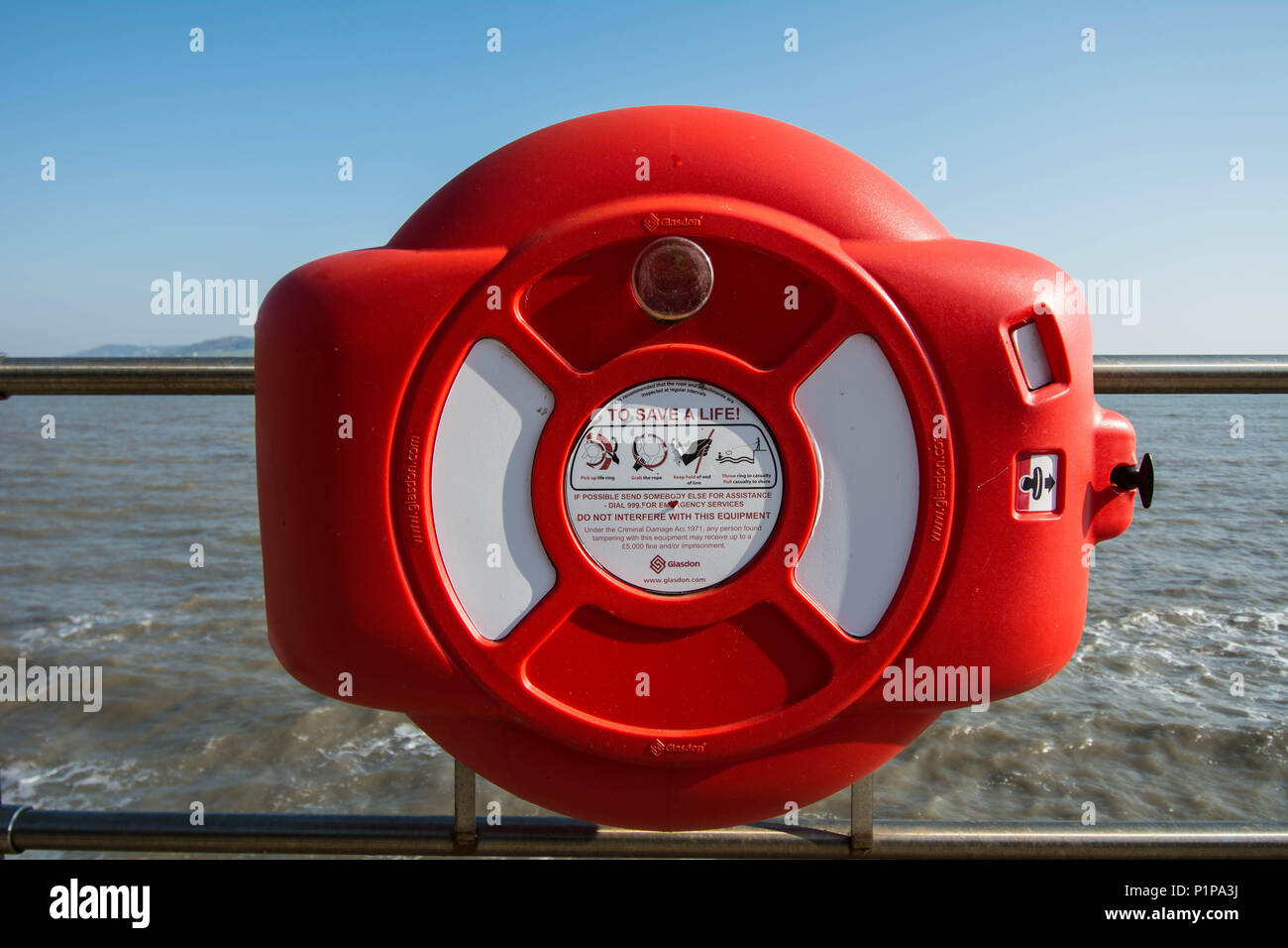 Lime Regis life guard rescue can buoy red emergency help helping