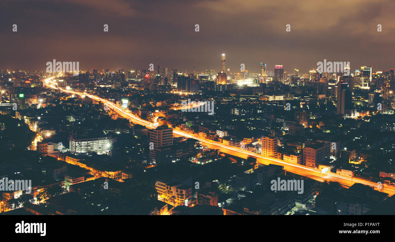 Modern urban landscape and the bustling streets in the evening Stock Photo
