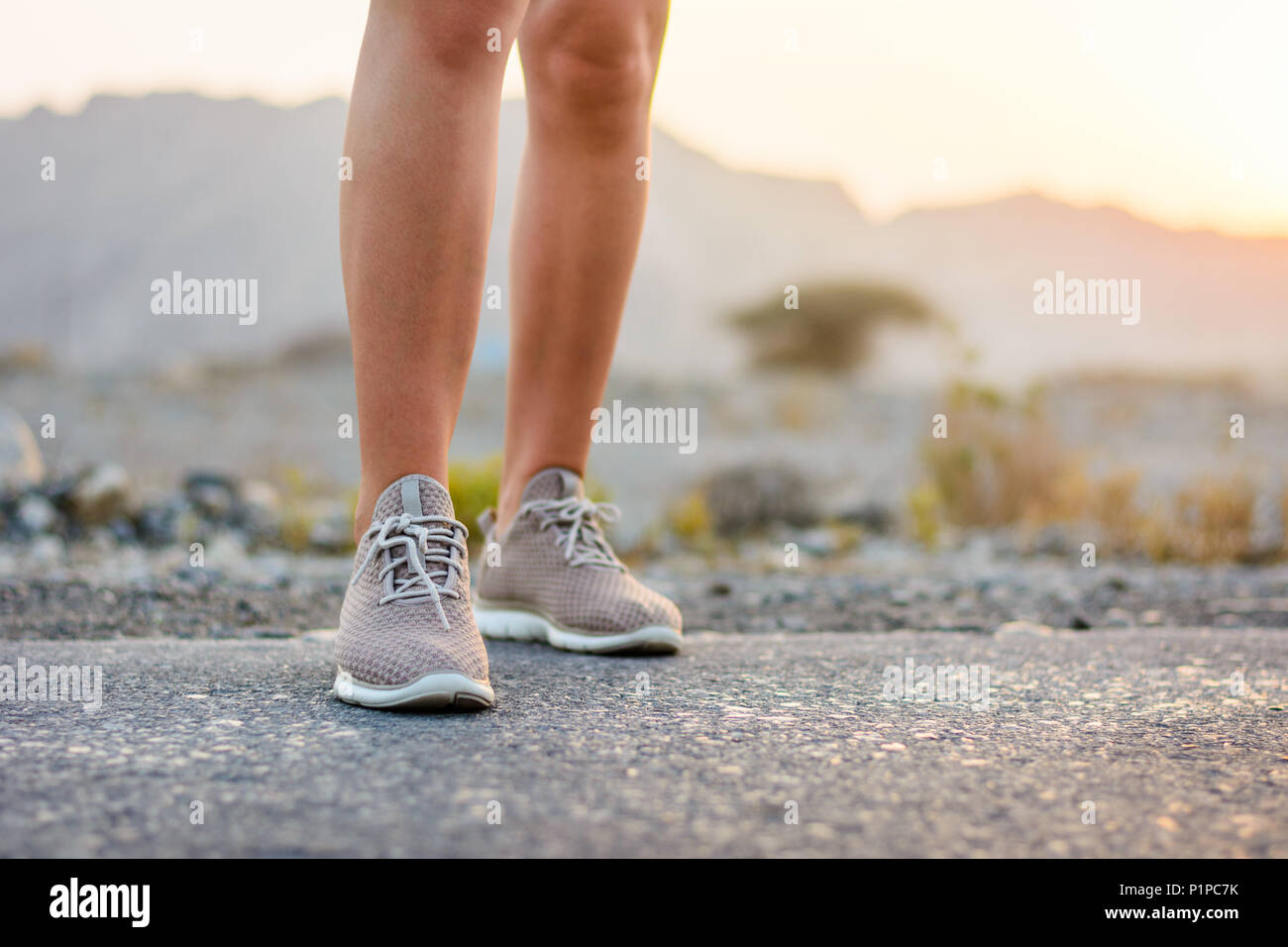 Runner standing in the desert low angle view Stock Photo