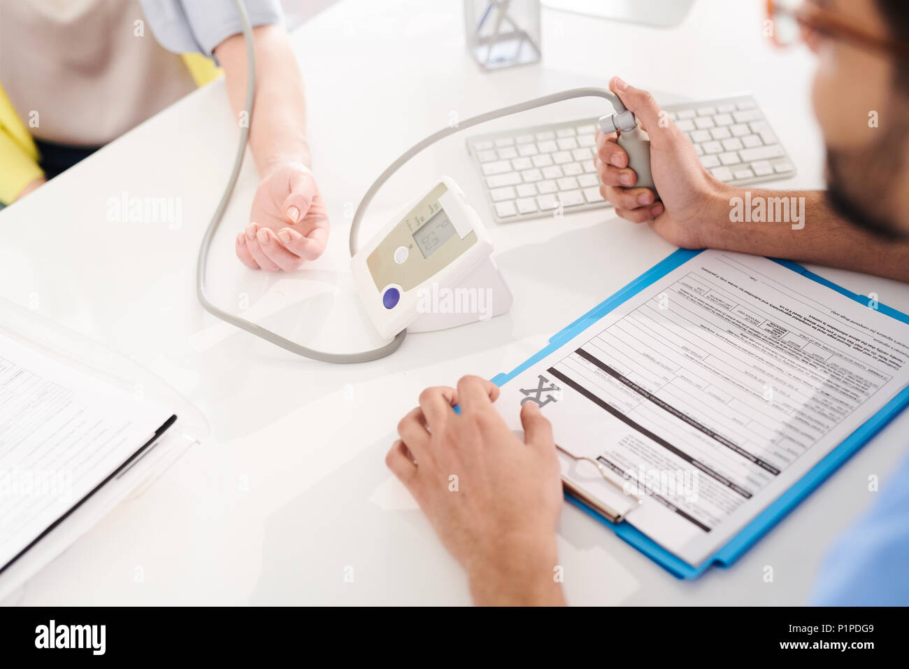 Doctor Measuring Blood Pressure Stock Photo Alamy