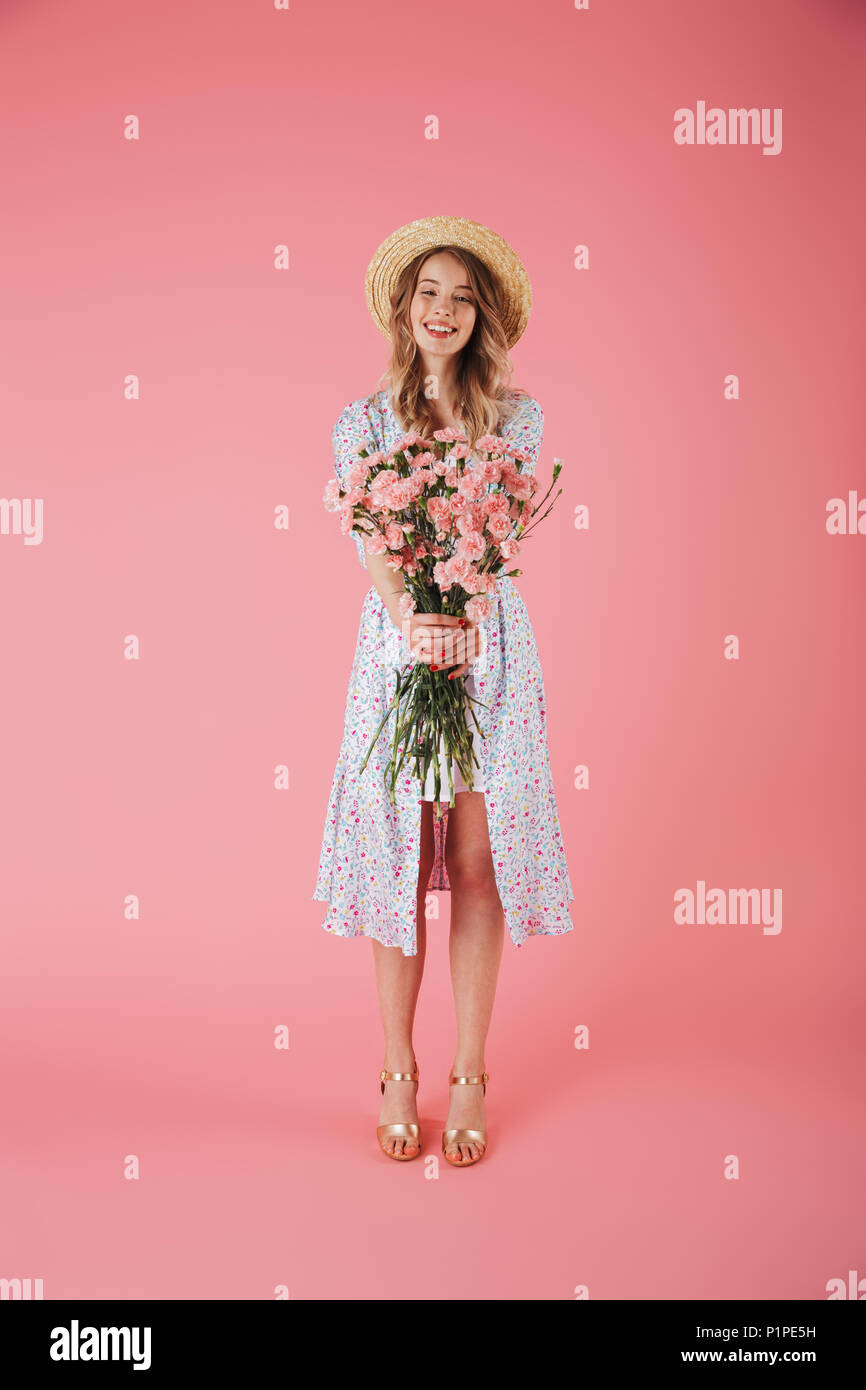 Full length portrait of a beautiful young woman in summer dress and ...