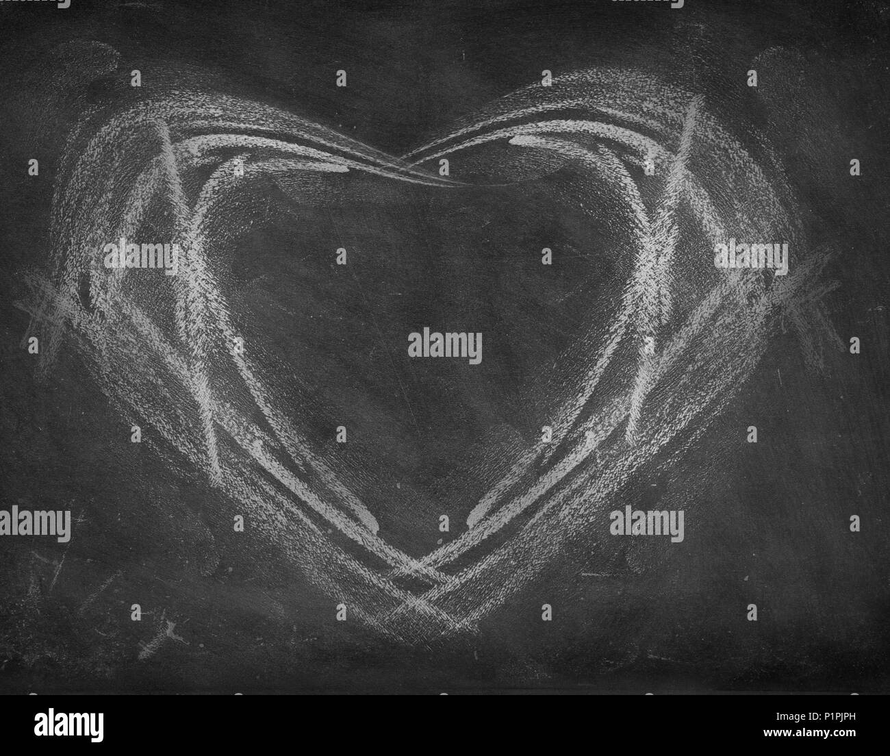Heart drawn on black board Stock Photo