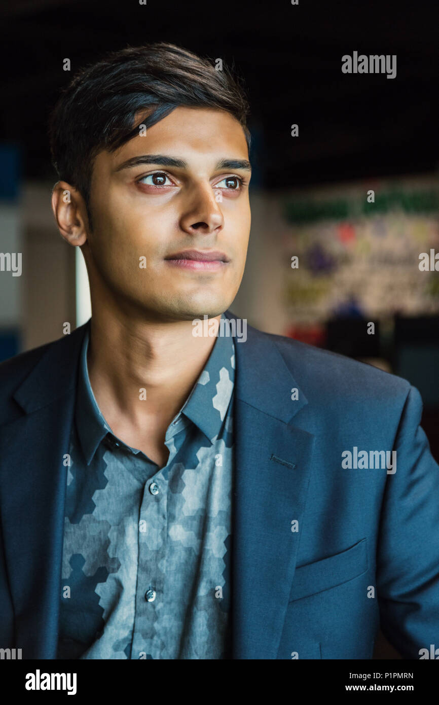 Portrait of a young millennial businessman in the workplace; Sherwood Park, Alberta, Canada Stock Photo