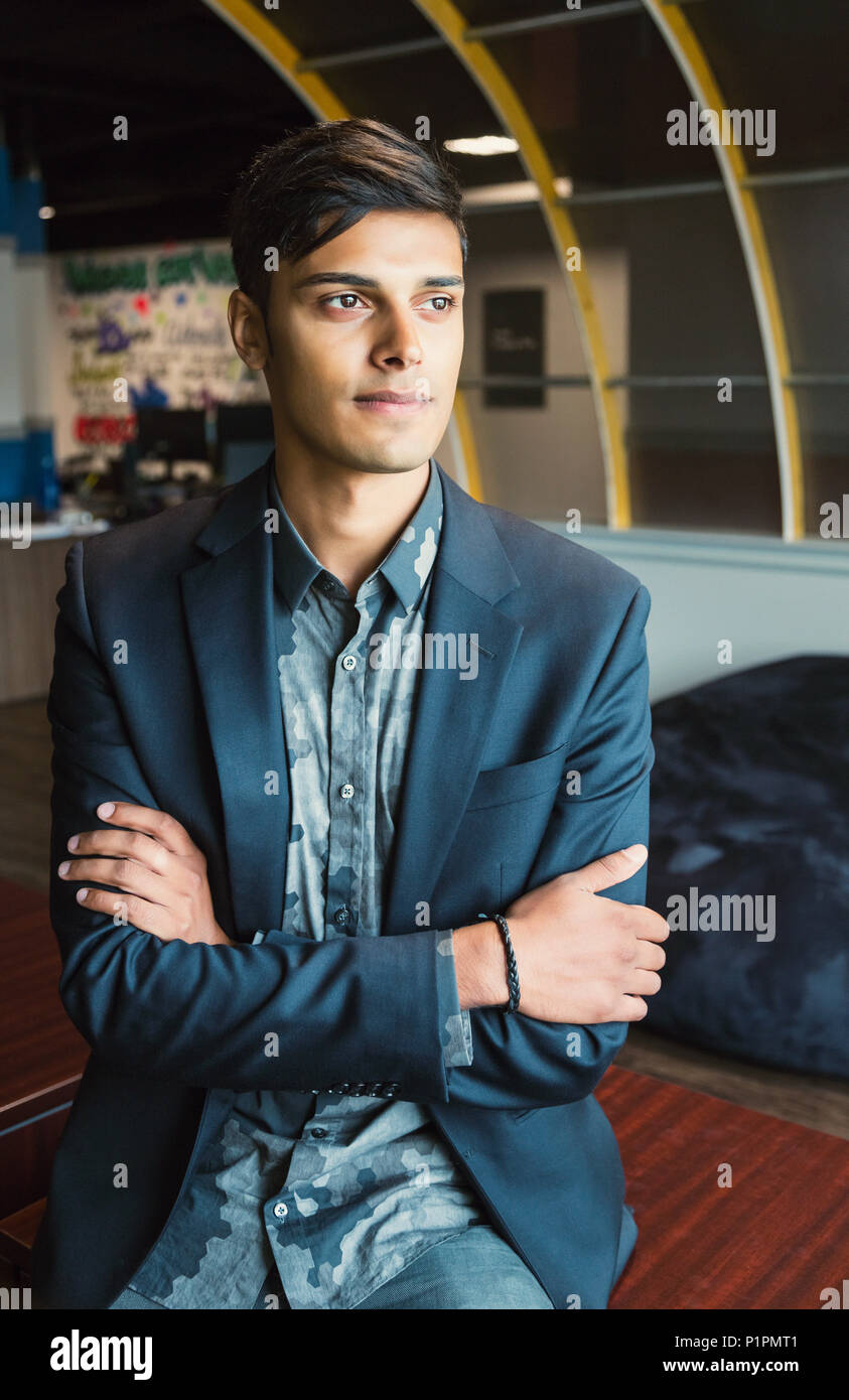 Portrait of a young millennial businessman in the workplace; Sherwood Park, Alberta, Canada Stock Photo