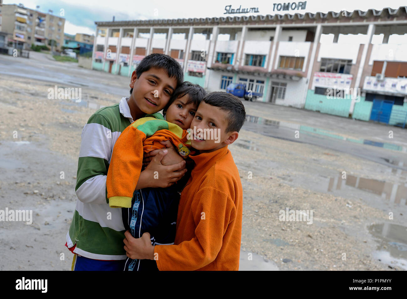 Berat, Albania, children posing in front of Tomori Stadium Stock Photo