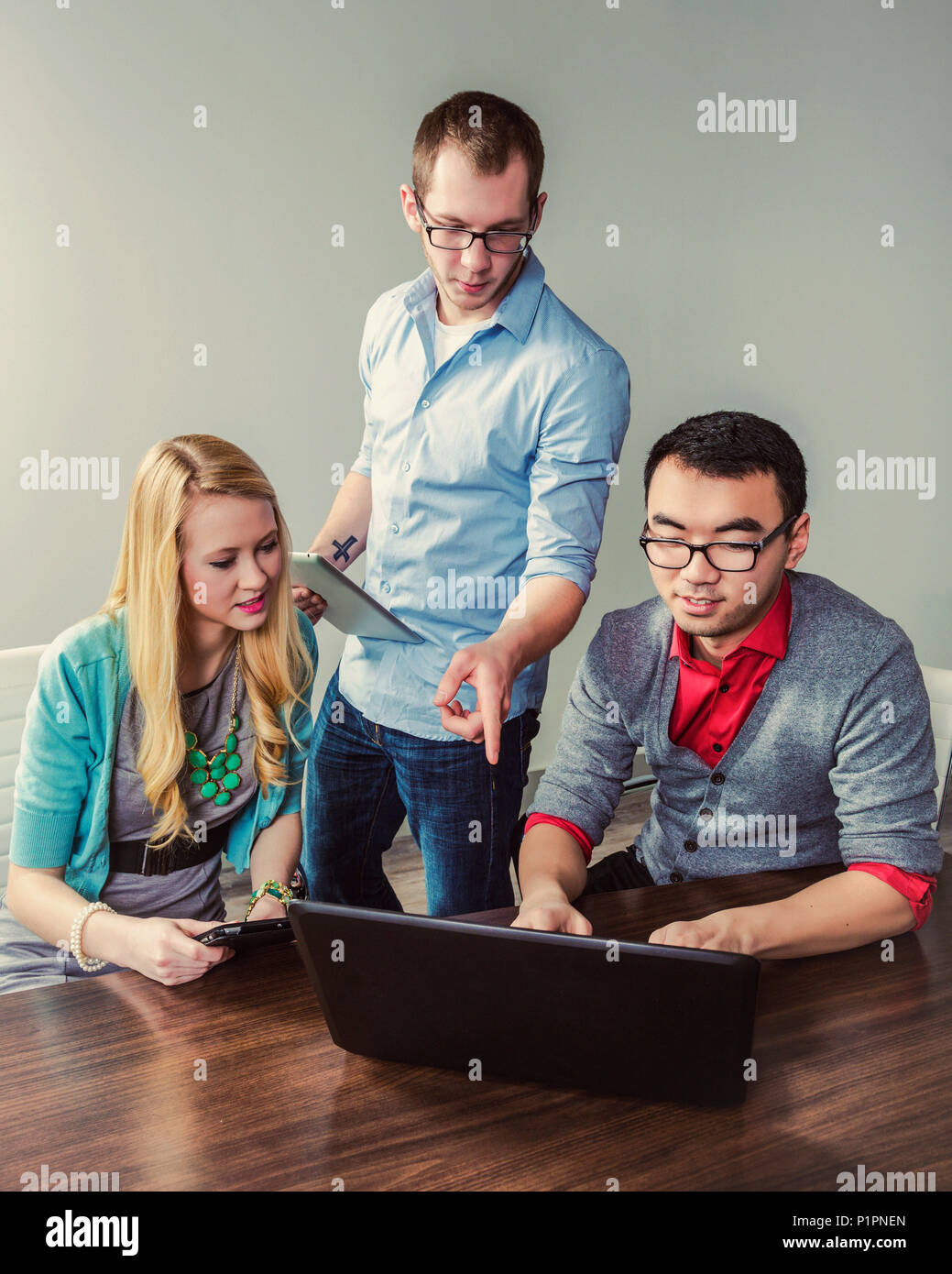 Young millennial business professionals working together in a