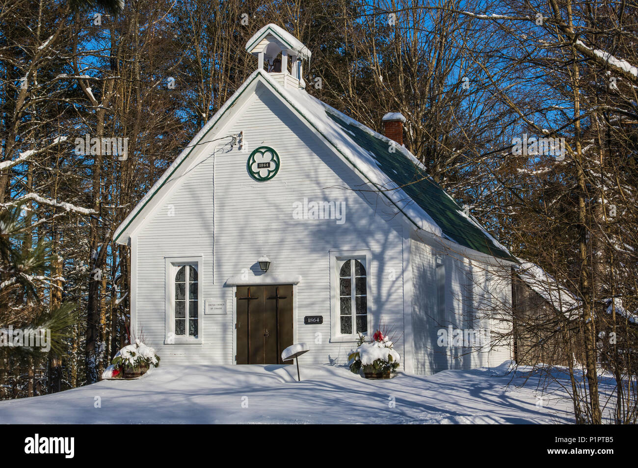 Little white church in the country in winter; Fulford, Quebec, Canada
