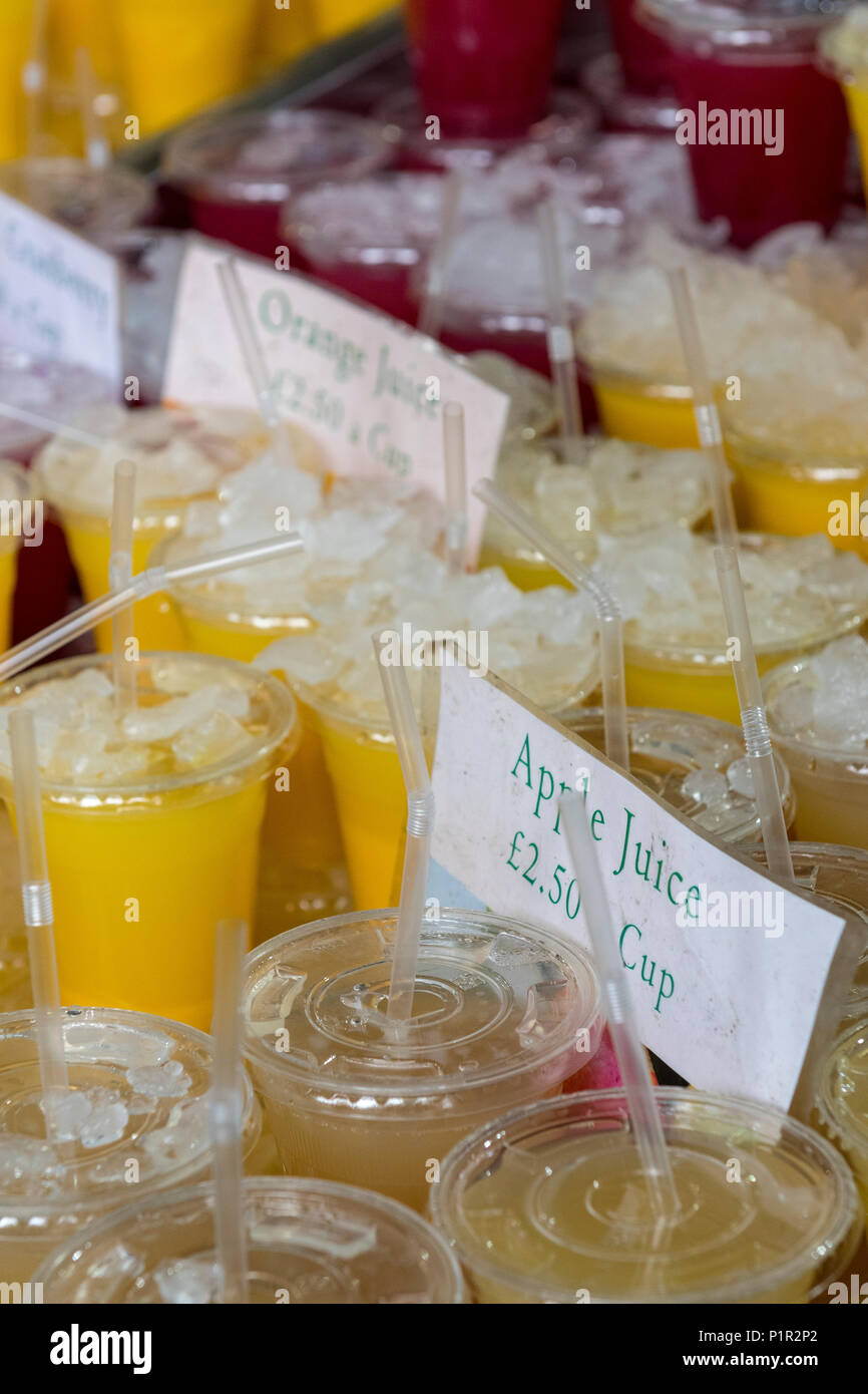 a selection or variety of different flavoured fruit juices and drinks