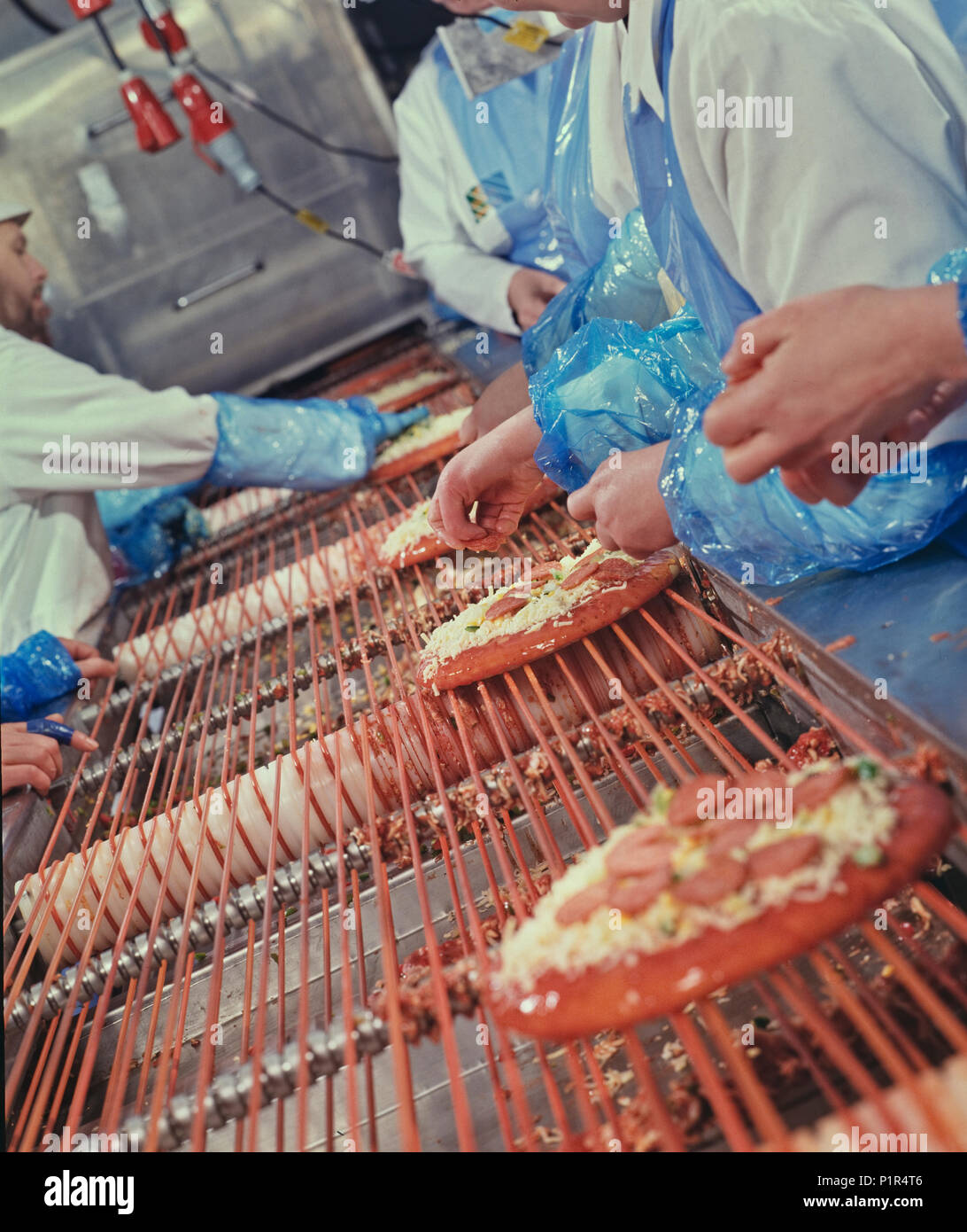 Large-scale pizza processing Stock Photo - Alamy