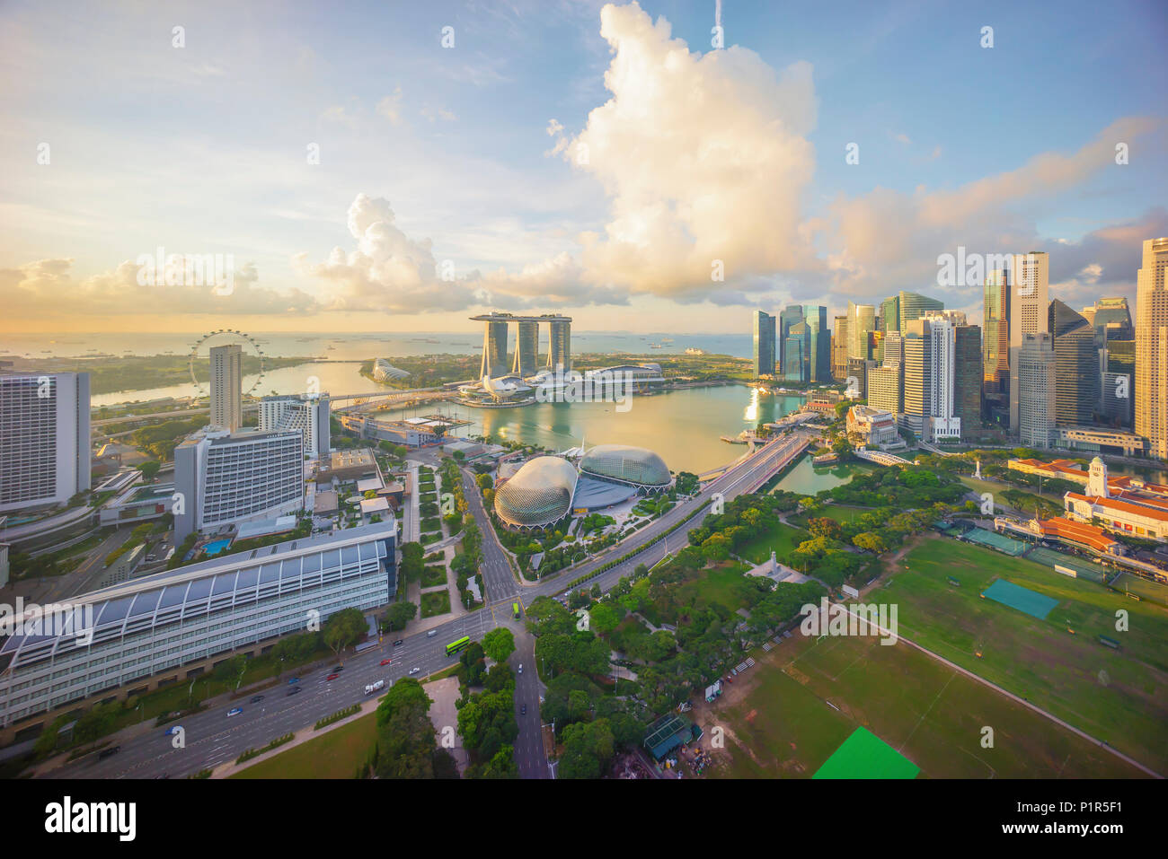 Aerial view of cloudy sunrise at Marina Bay Singapore city skyline ...