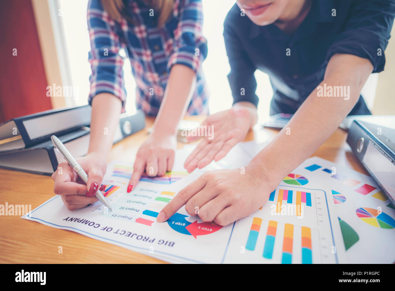 Financial paper charts and graphs on the table Stock Photo
