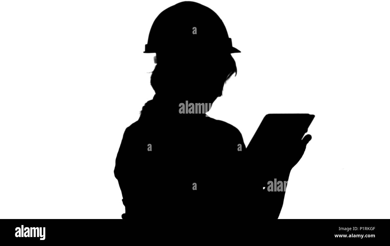 Silhouette Asian engineer woman using tablet track matte Stock Photo
