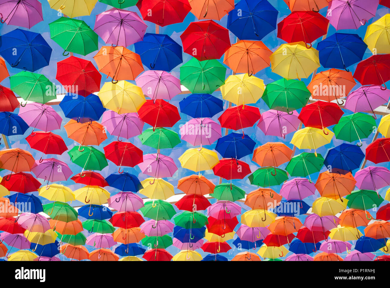 Colourful umbrellas in the street Stock Photo