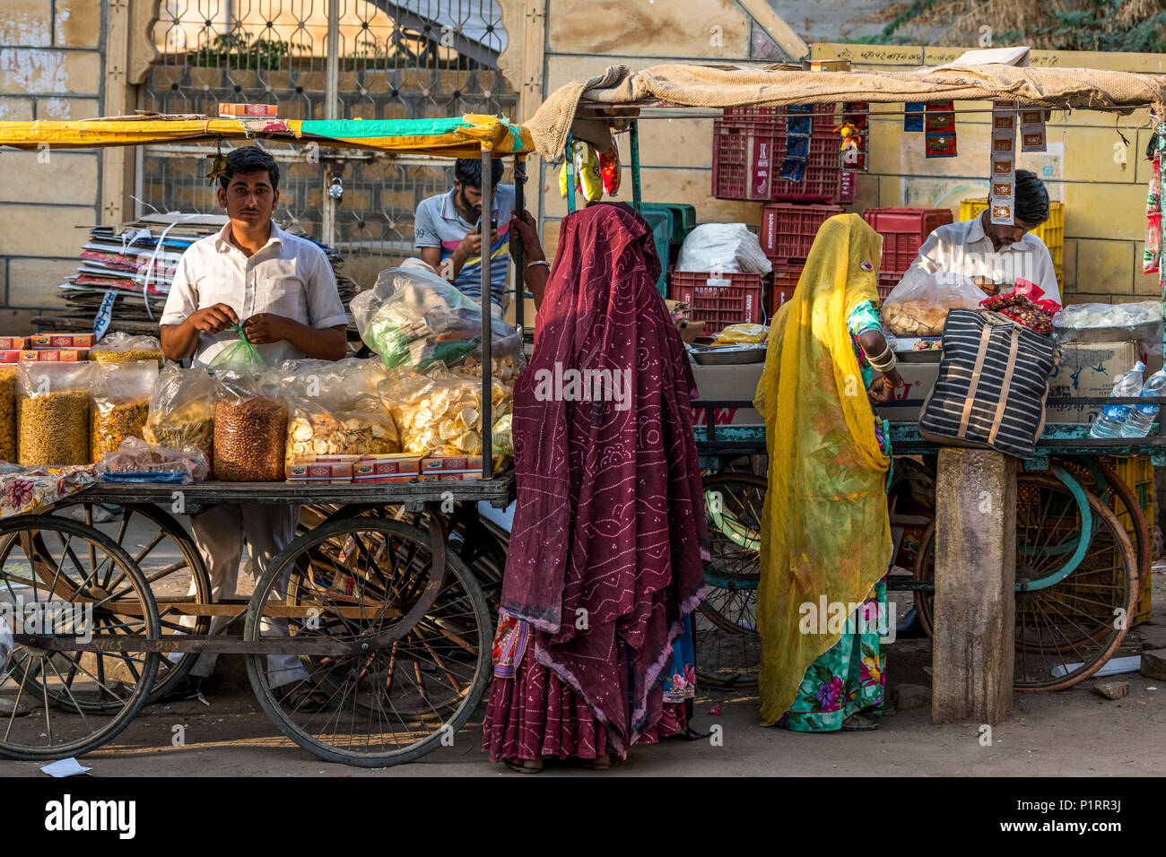 Indian women shopping from street vendors; Jaisalmer, Rajasthan, India