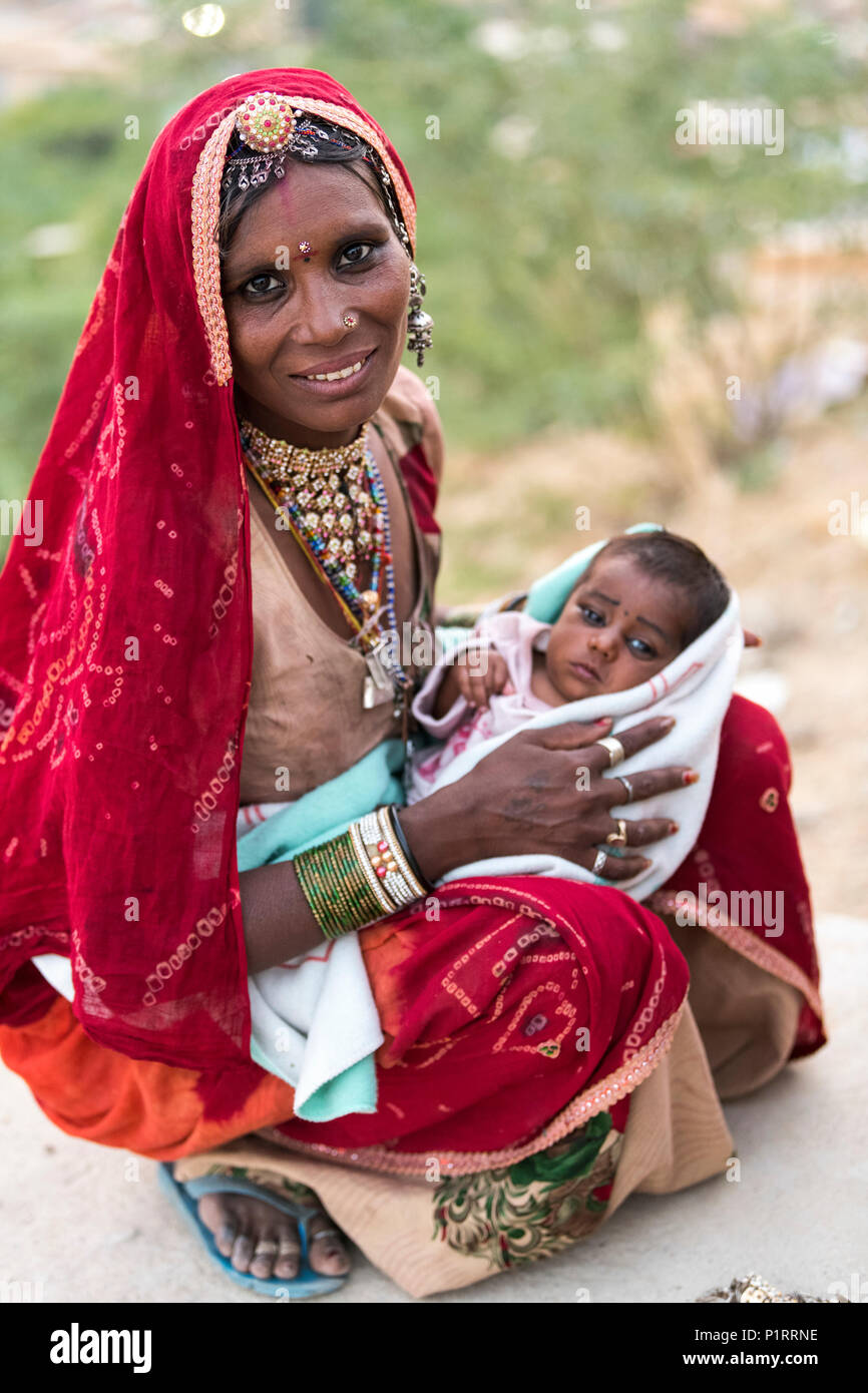 A mother holding her baby girl; Jaisalmer, Rajasthan, India Stock Photo