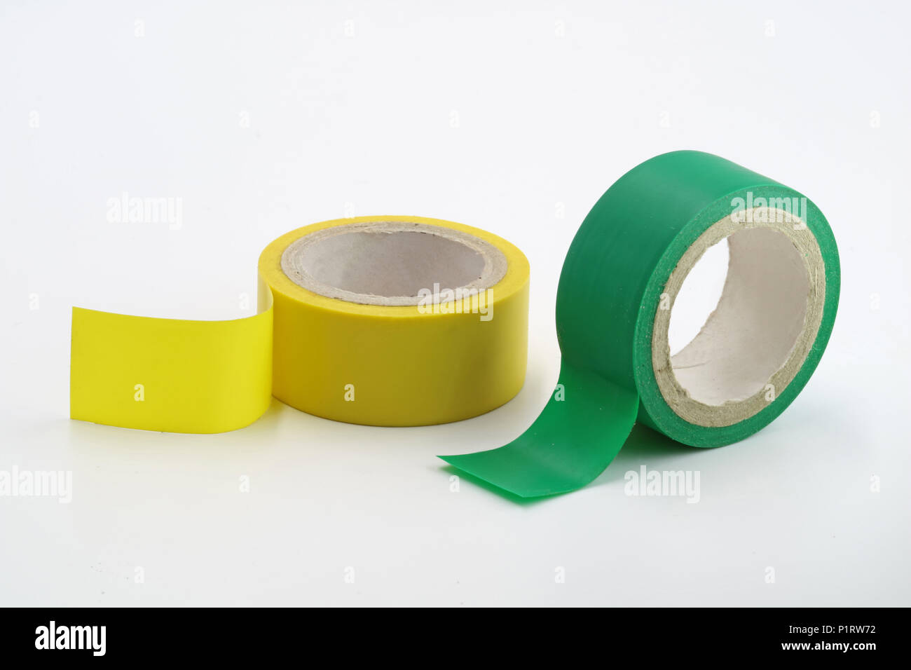 yellow and green insulating tapes are isolated on a white background Stock Photo