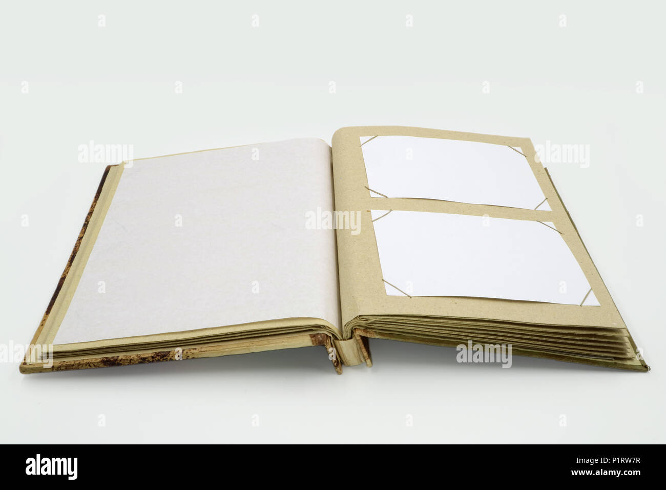 open diary or photo album book on white background Stock Photo - Alamy
