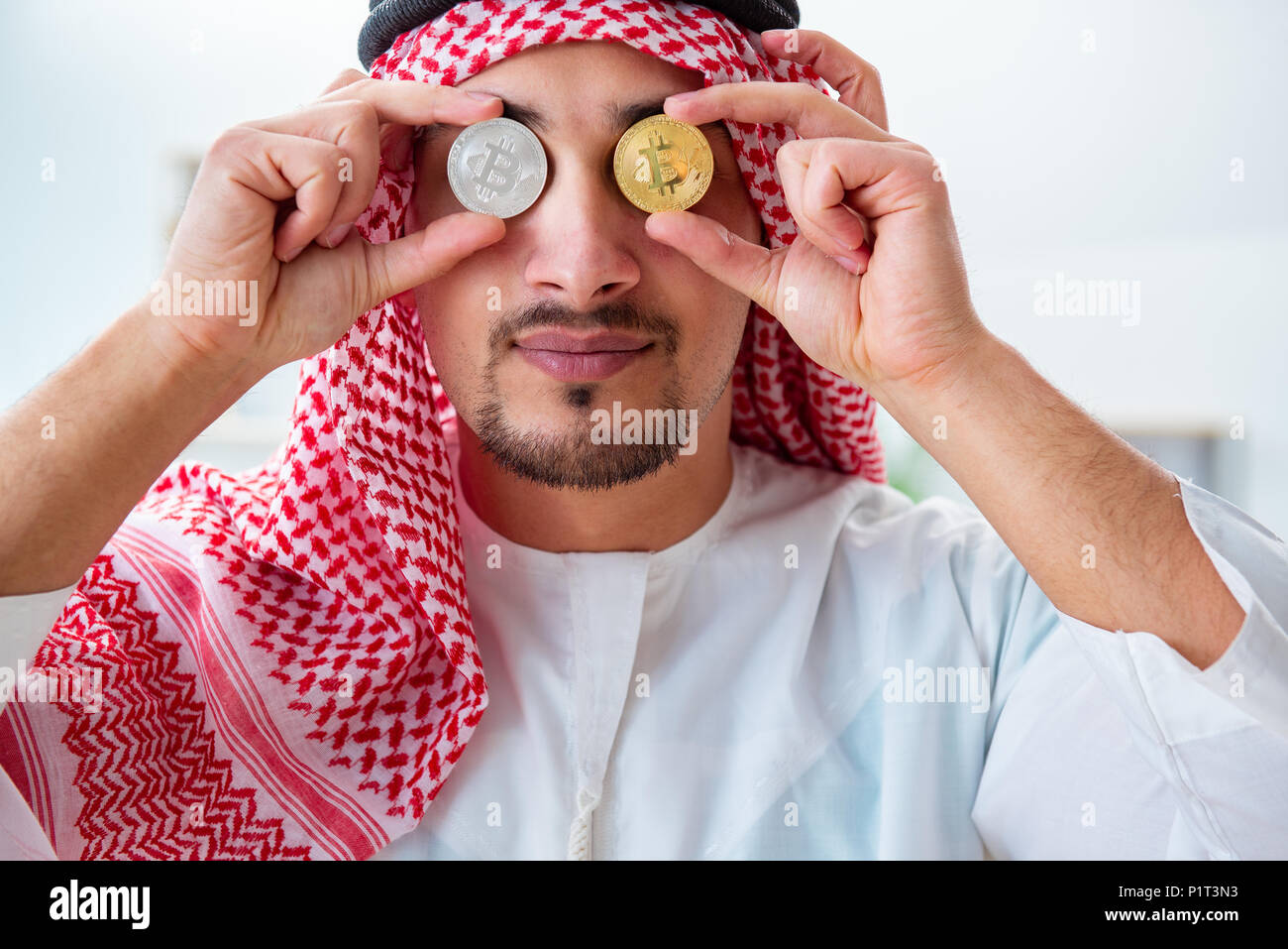 Arab man with bitcoin in cryptocurrency mining concept Stock Photo - Alamy