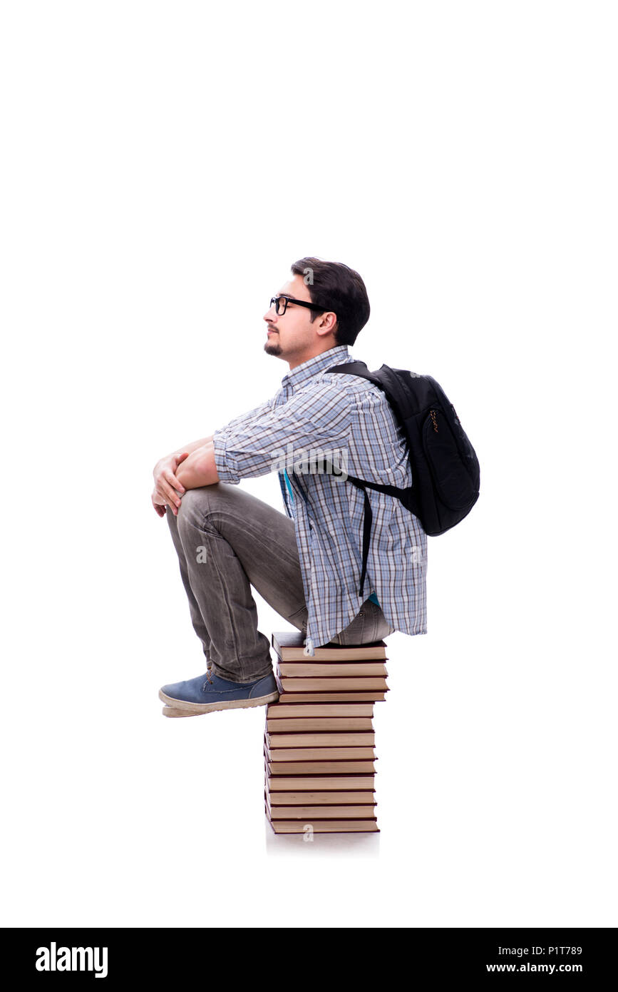 Young student sitting on top of book stack on white Stock Photo - Alamy