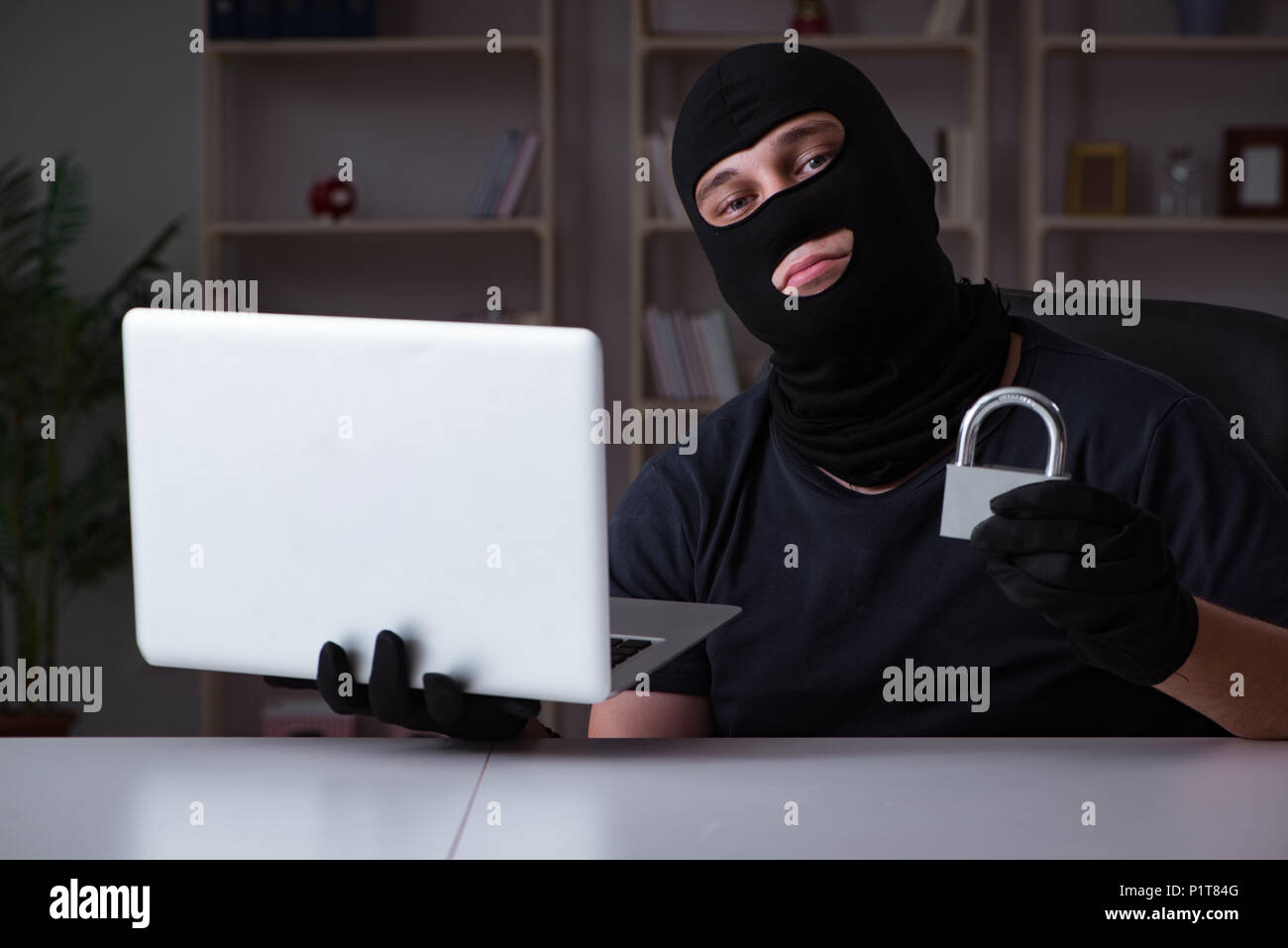 Hacker hacking computer late at night Stock Photo - Alamy