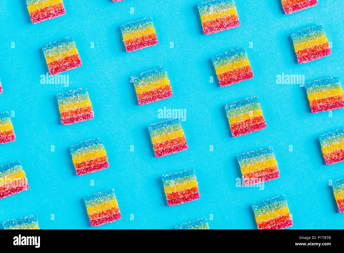 Colorful candies pattern on a blue background. Top view. Stock Photo