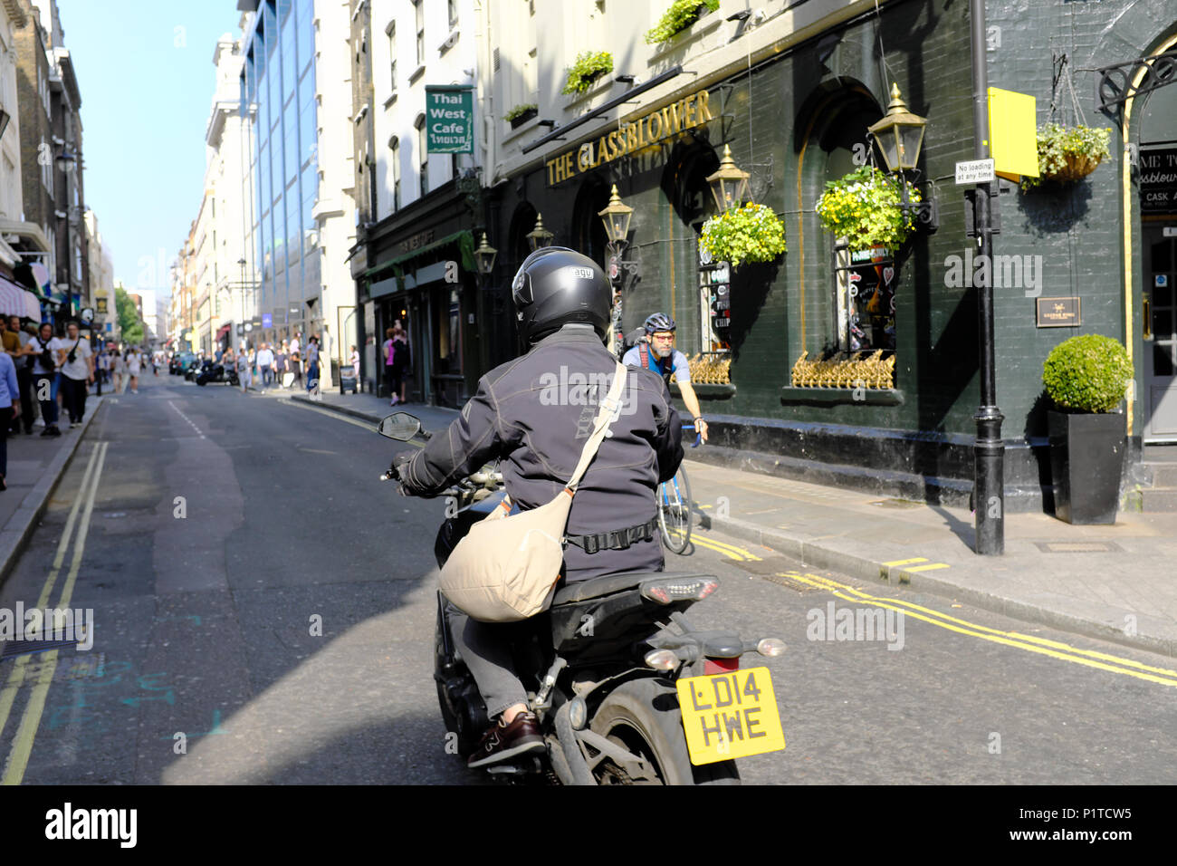 moped scooter rider, Soho, London, England, UK Stock Photo Alamy