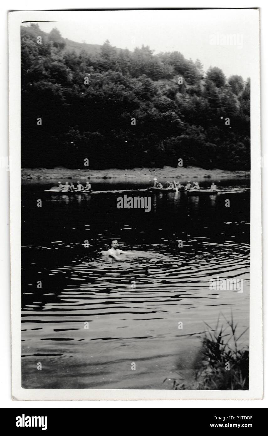 THE CZECHOSLOVAK SOCIALIST REPUBLIC - CIRCA 1950s: Retro photo shows swimmer in the river Summer vacation theme. Vintage black & white photography. Stock Photo
