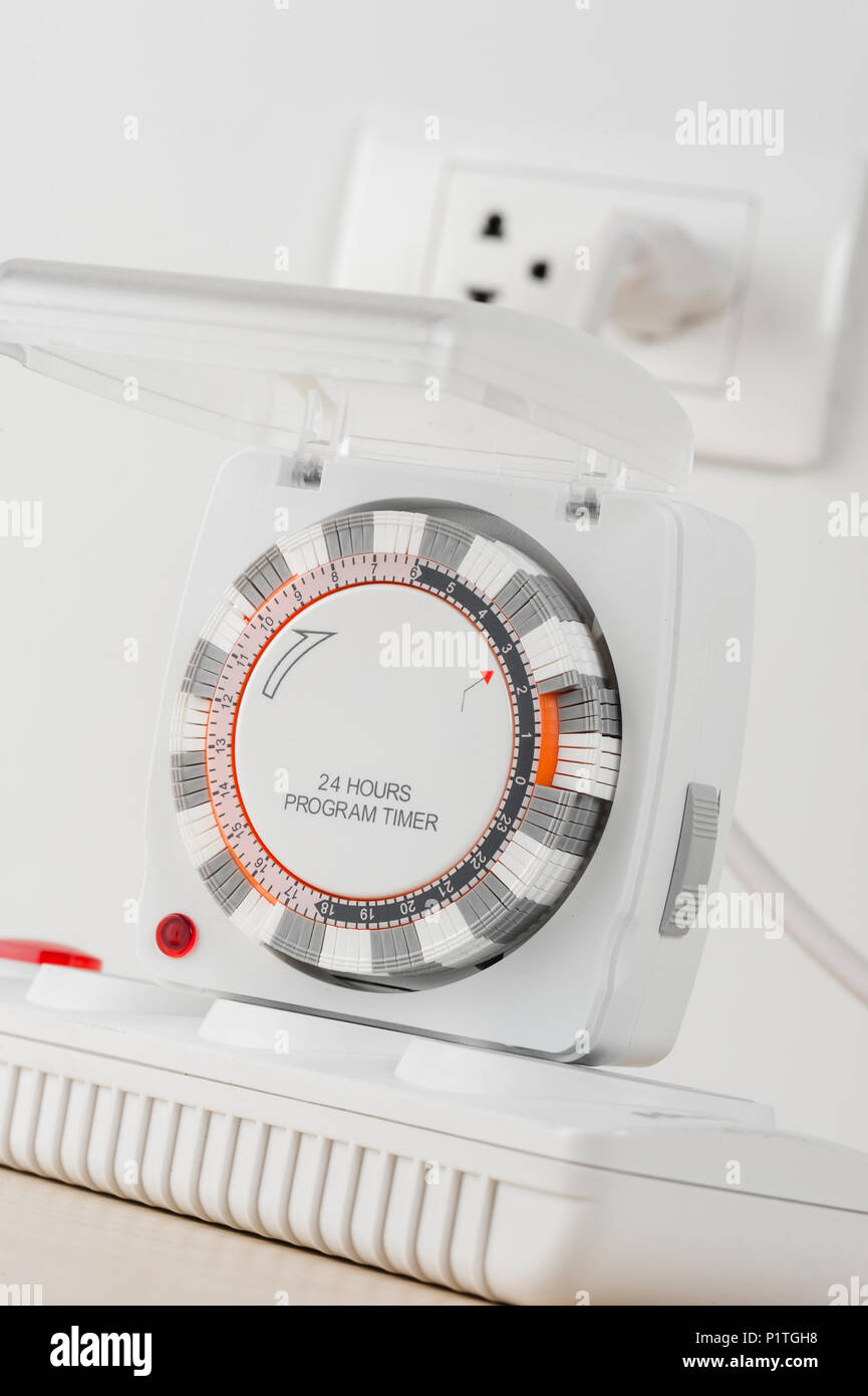 electrical socket with 24 hours program timer Stock Photo - Alamy