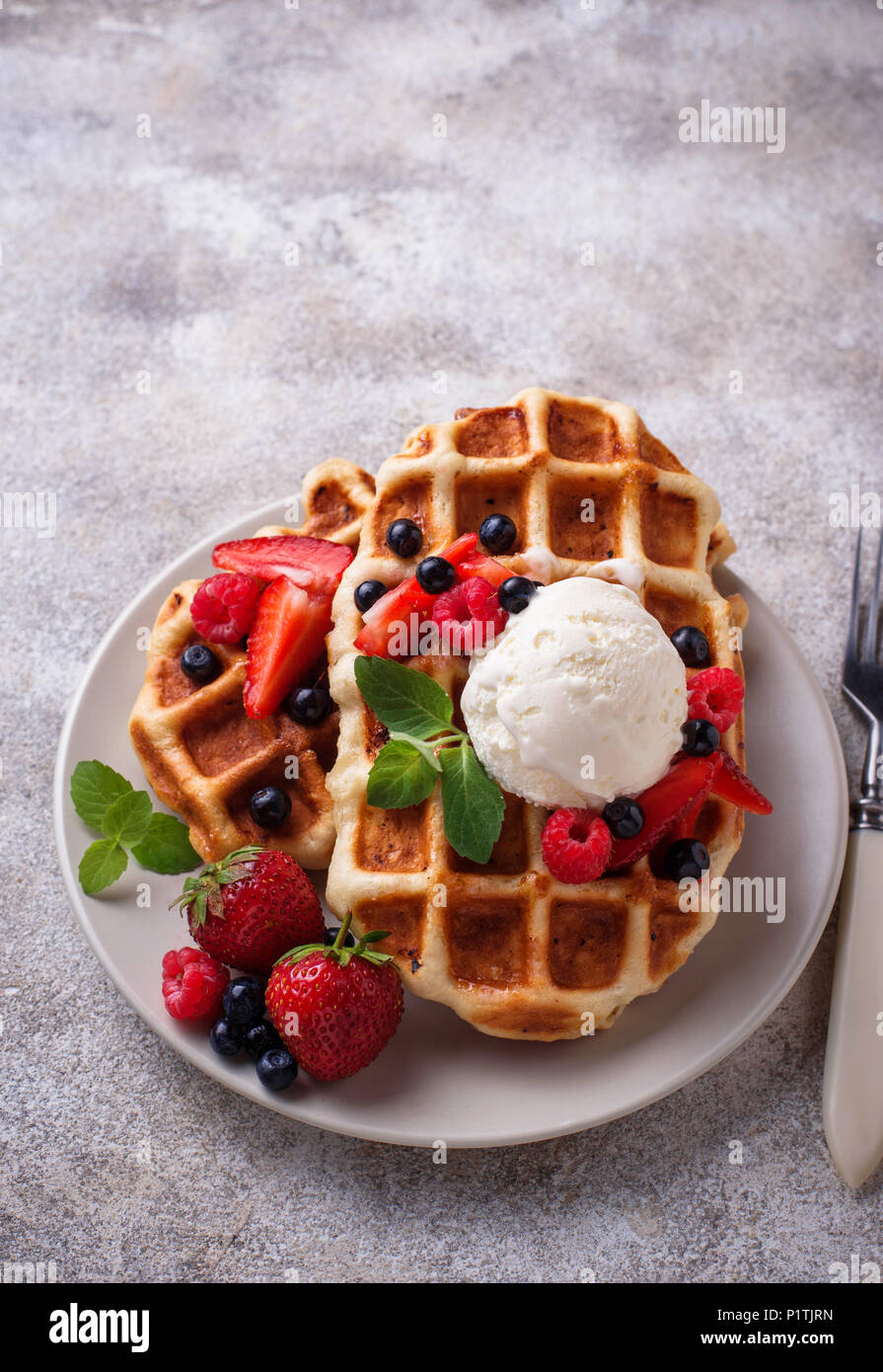 Belgium waffles with berries and ice cream Stock Photo - Alamy