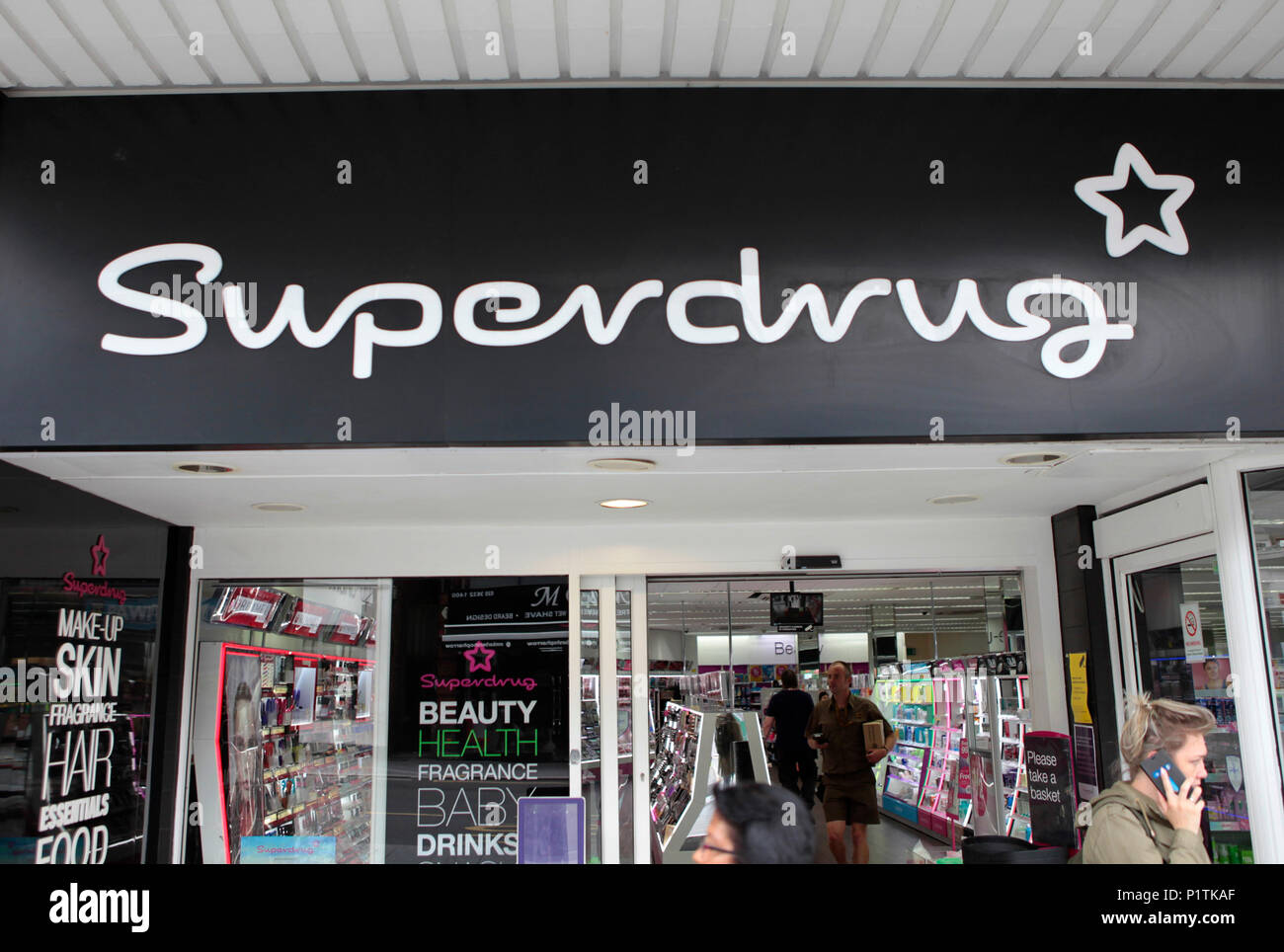 a superdrug beauty and pharmacy store. Shops and people shopping in Harrow,  middlesex, London, UK Stock Photo - Alamy