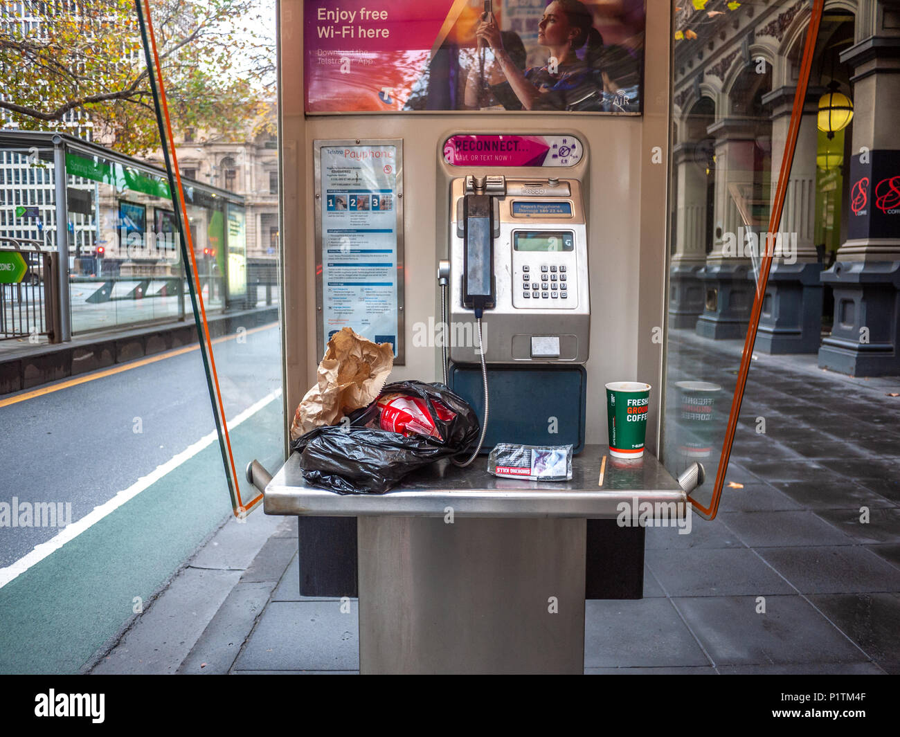 Litter In A Telephone Booth In Melbourne s CBD VIC Australia Stock litter-in-a-telephone-booth-in-melbourne-s-cbd-vic-australia-stock