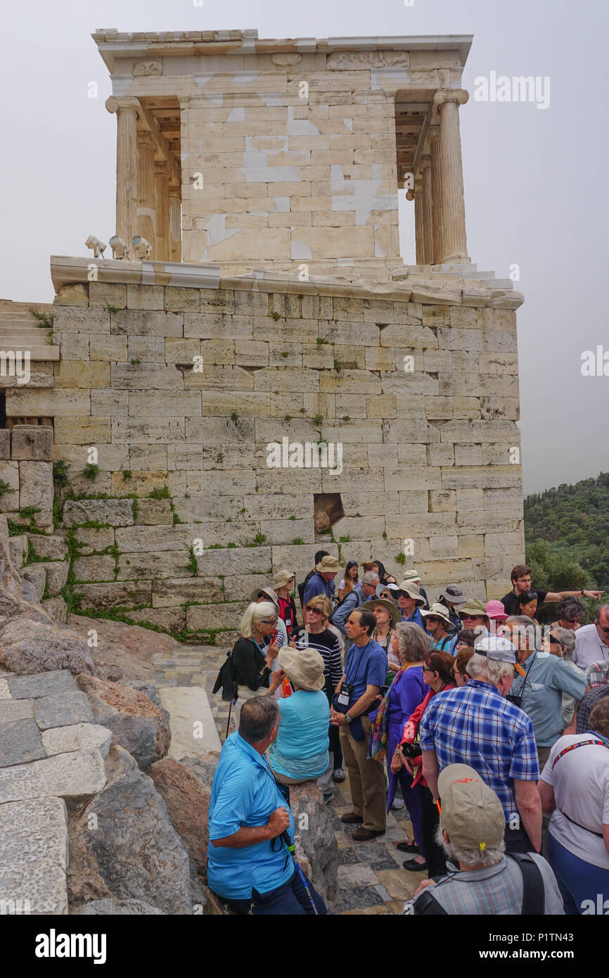 Athens, Greece - April 16, 2018: Tourists and guides visit the Temple ...