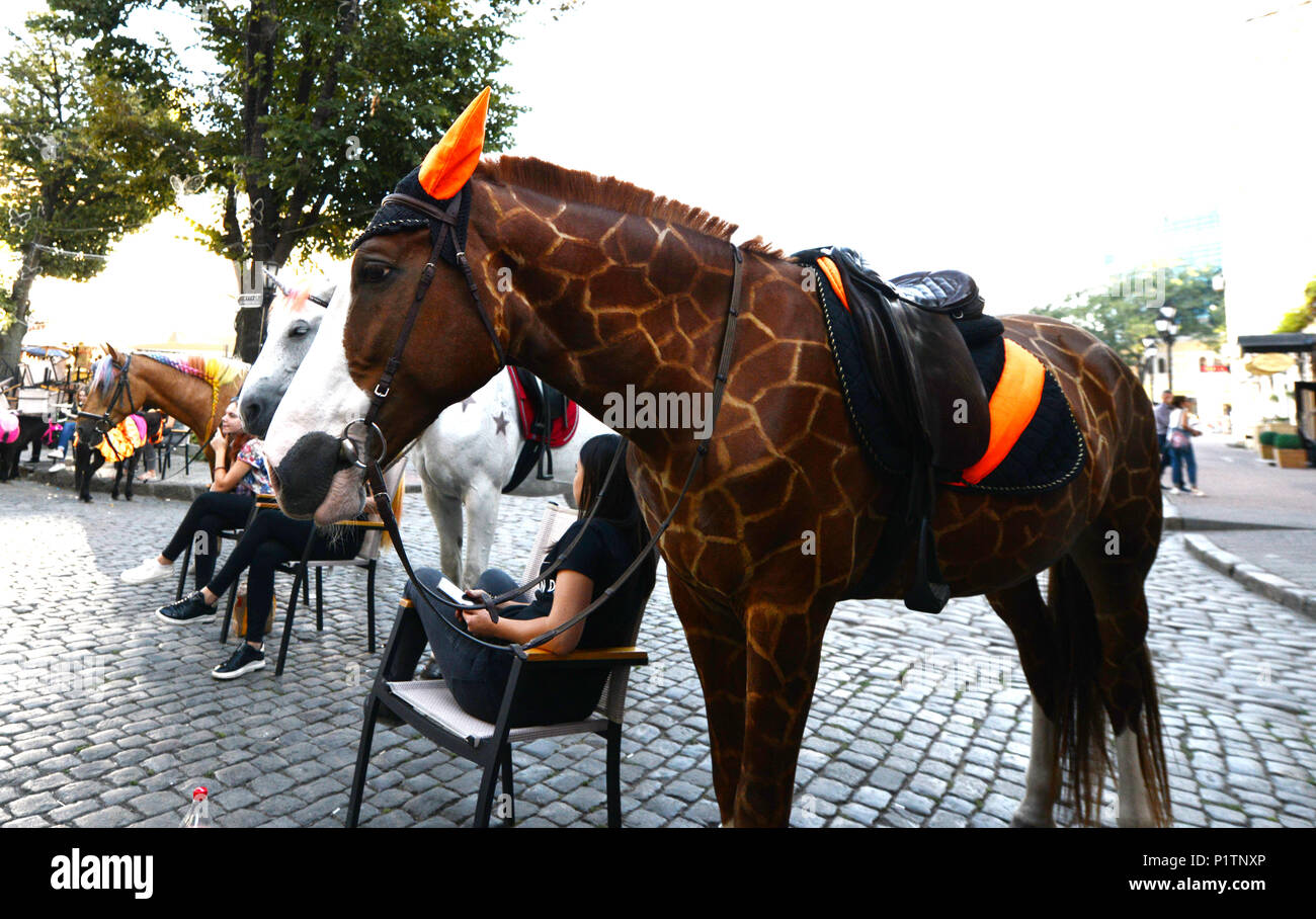A colorful horse decorated with giraffe patterns. Stock Photo