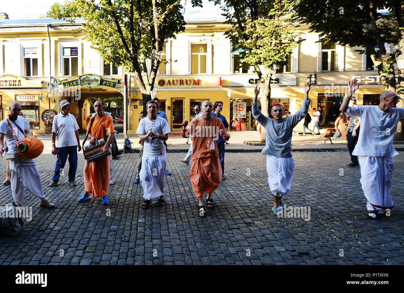 Street chanting of Hare Krishna by Harinamas in Odessa's Derybasivska Street. Stock Photo