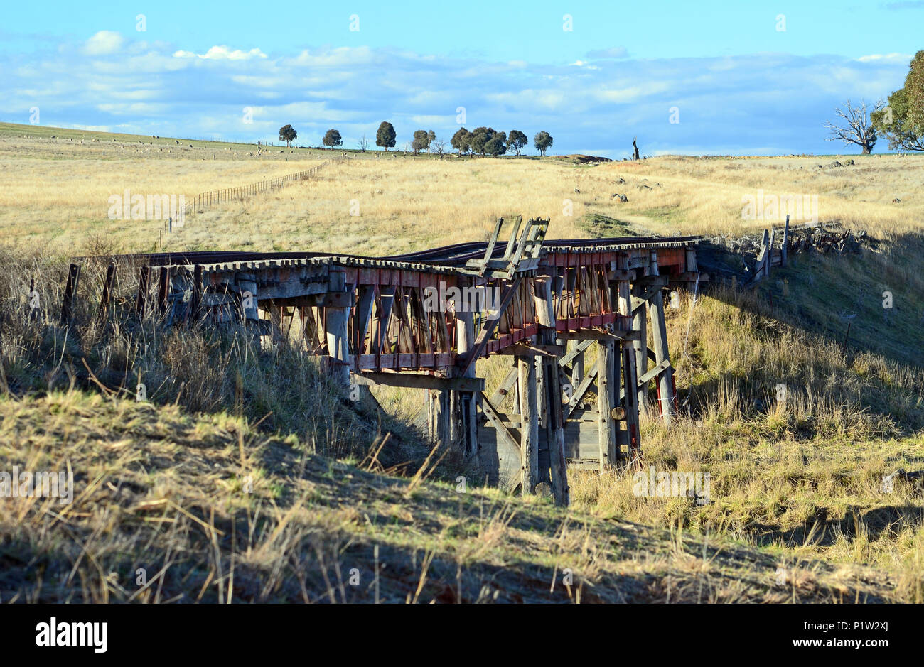 Old abandoned wooden railway bridge over the Boorowa River, in rural