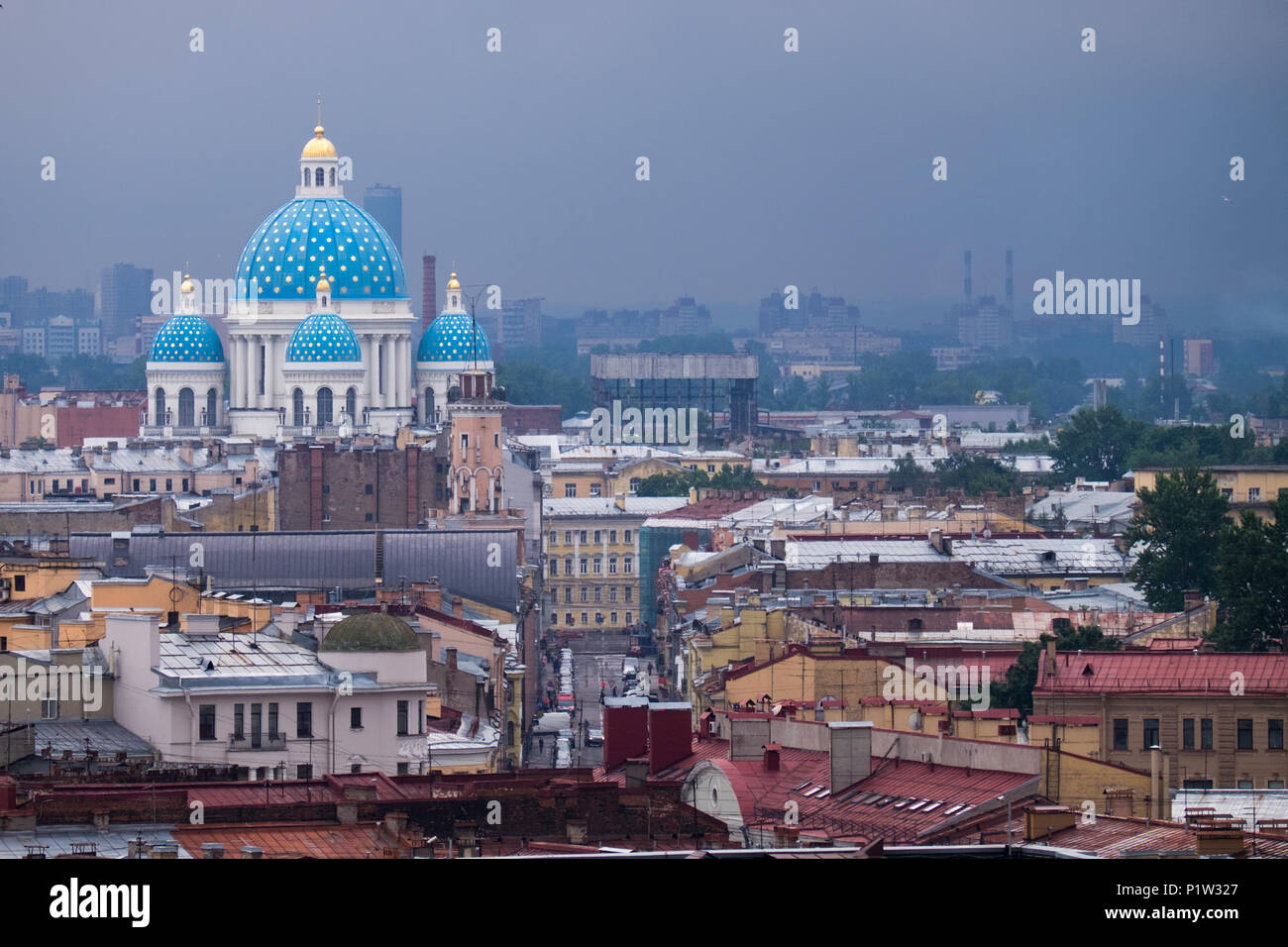 Russian church and city buildings on overcast day Stock Photo