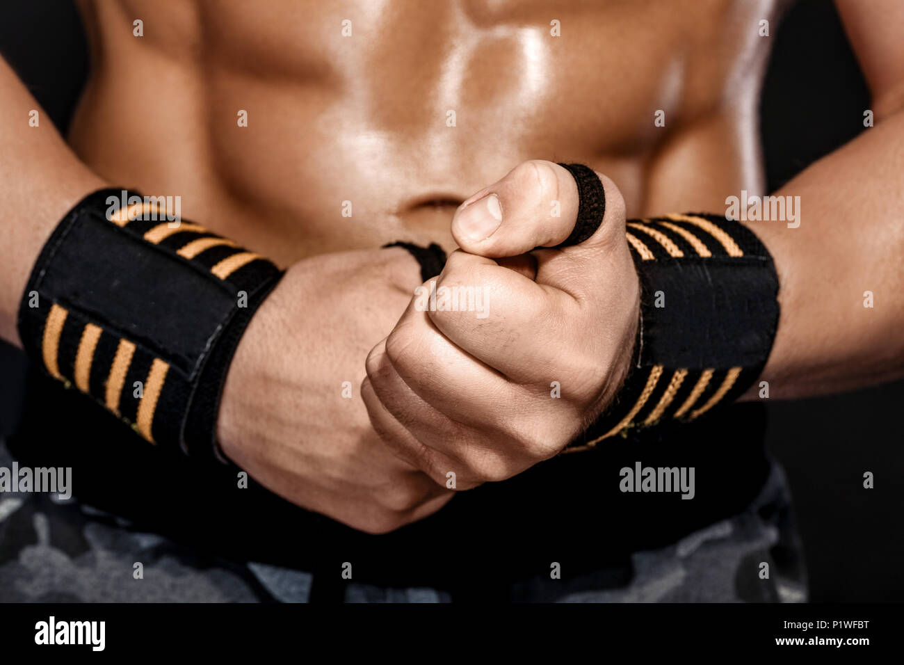 man wraps his wrist with sports wrap Stock Photo Alamy