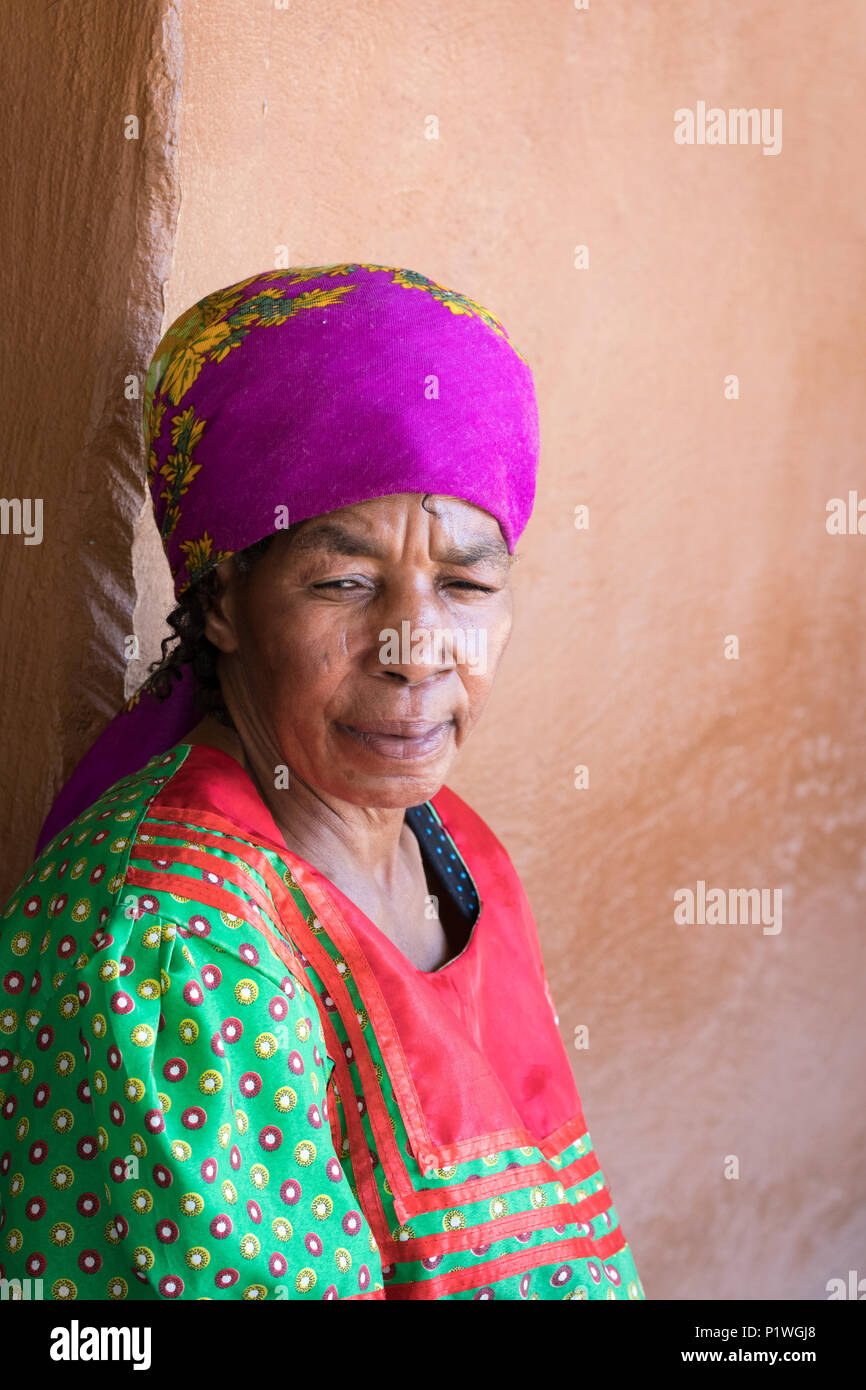 Lesedi Cultural Village, SOUTH AFRICA - 4 November 2016: Thoughtful senior African woman in colourful traditional clothing Stock Photo