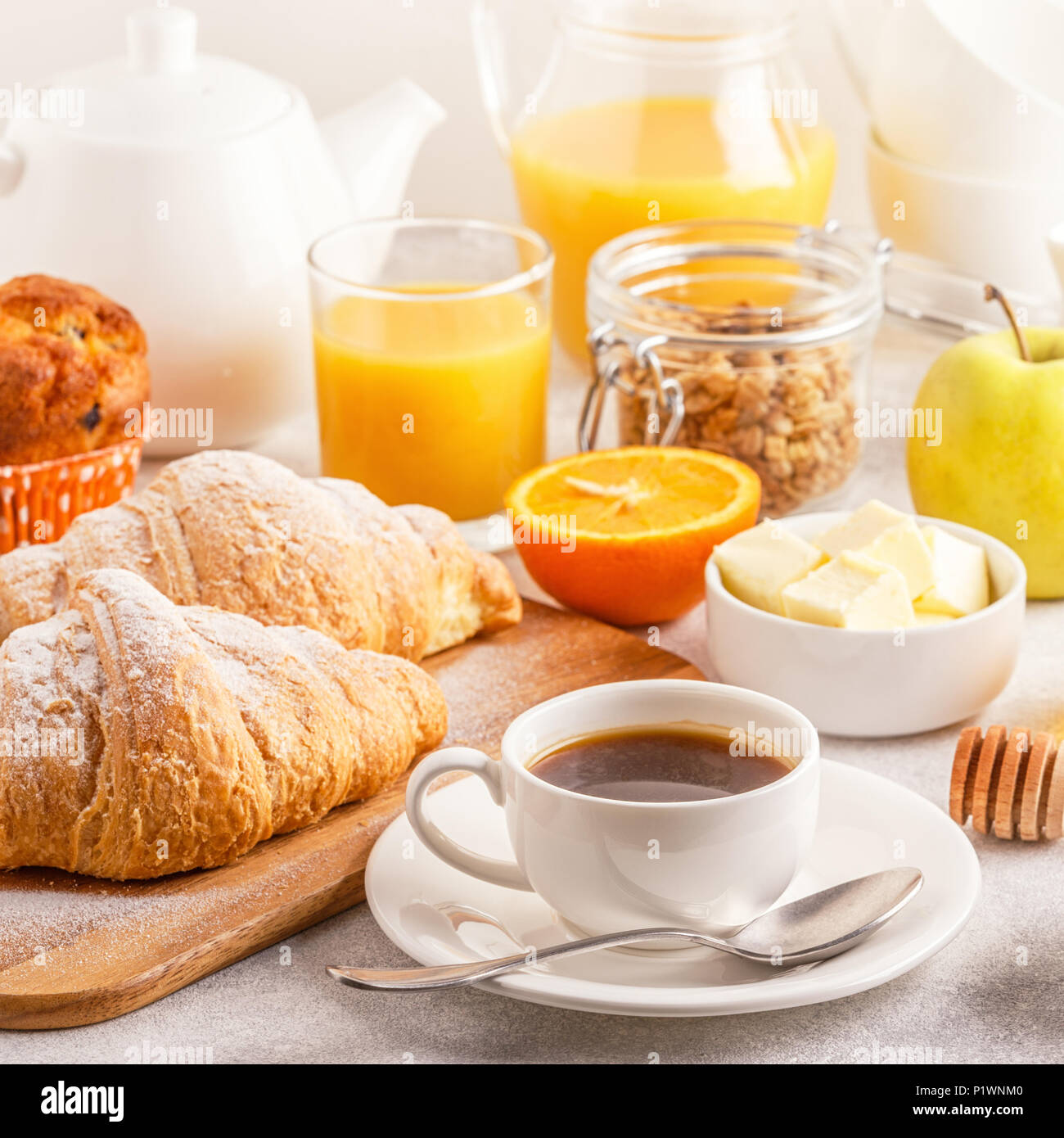 Continental breakfast with fresh croissants, orange juice and coffee, selective focuse. Stock Photo
