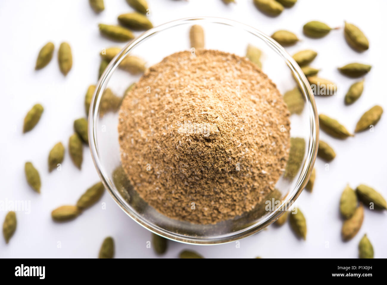 elaichi high resolution stock photography and images alamy https www alamy com elaichi or cardamom powder in bowl or heap over moody background with pods selective focus image207710345 html