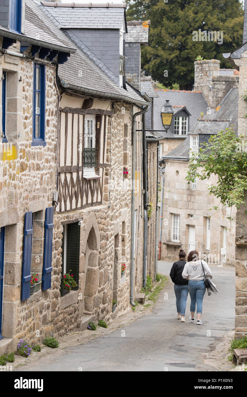 Two ladies walk down a lane in Moncontour, Côtes-d'Armor, Brittany, France. Stock Photo