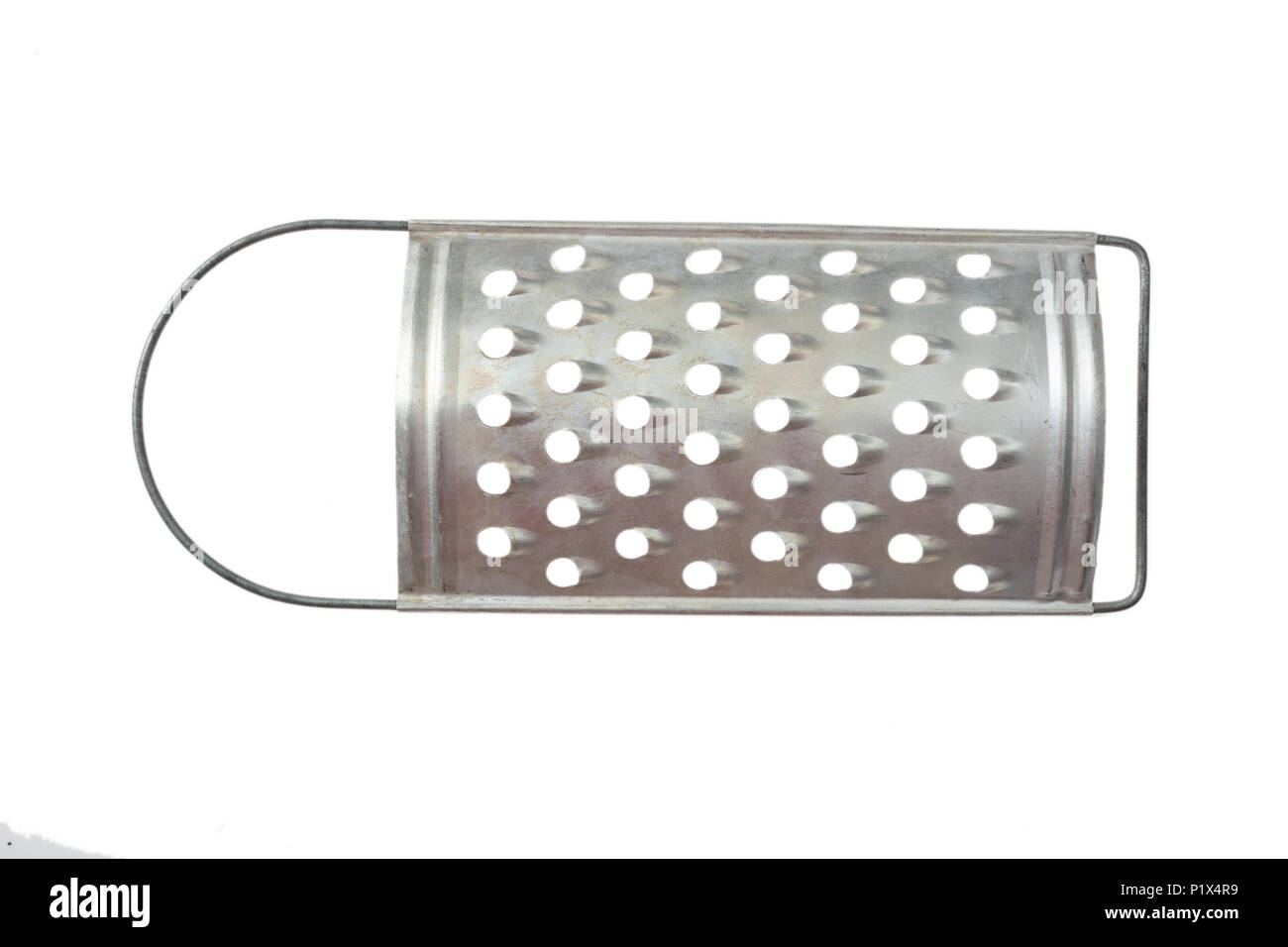 Grater in stainless steel isolated on white background /// cheese shredder  slicer cut out kitchen utensil tool kitchenware stainless object equipment  Stock Photo - Alamy