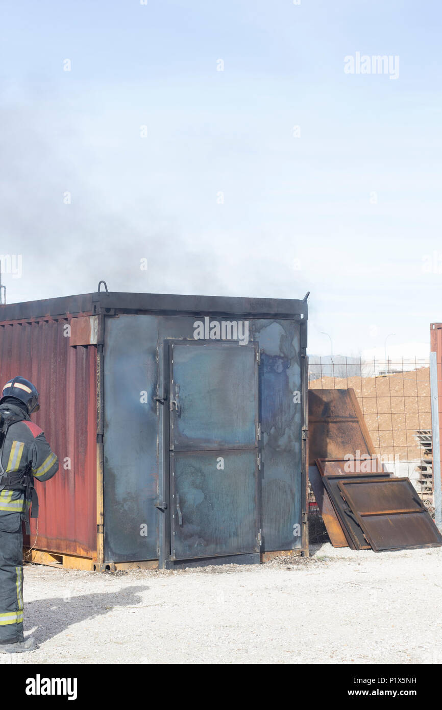 Firefighter putting out fire training station extinguisher backdraft ...