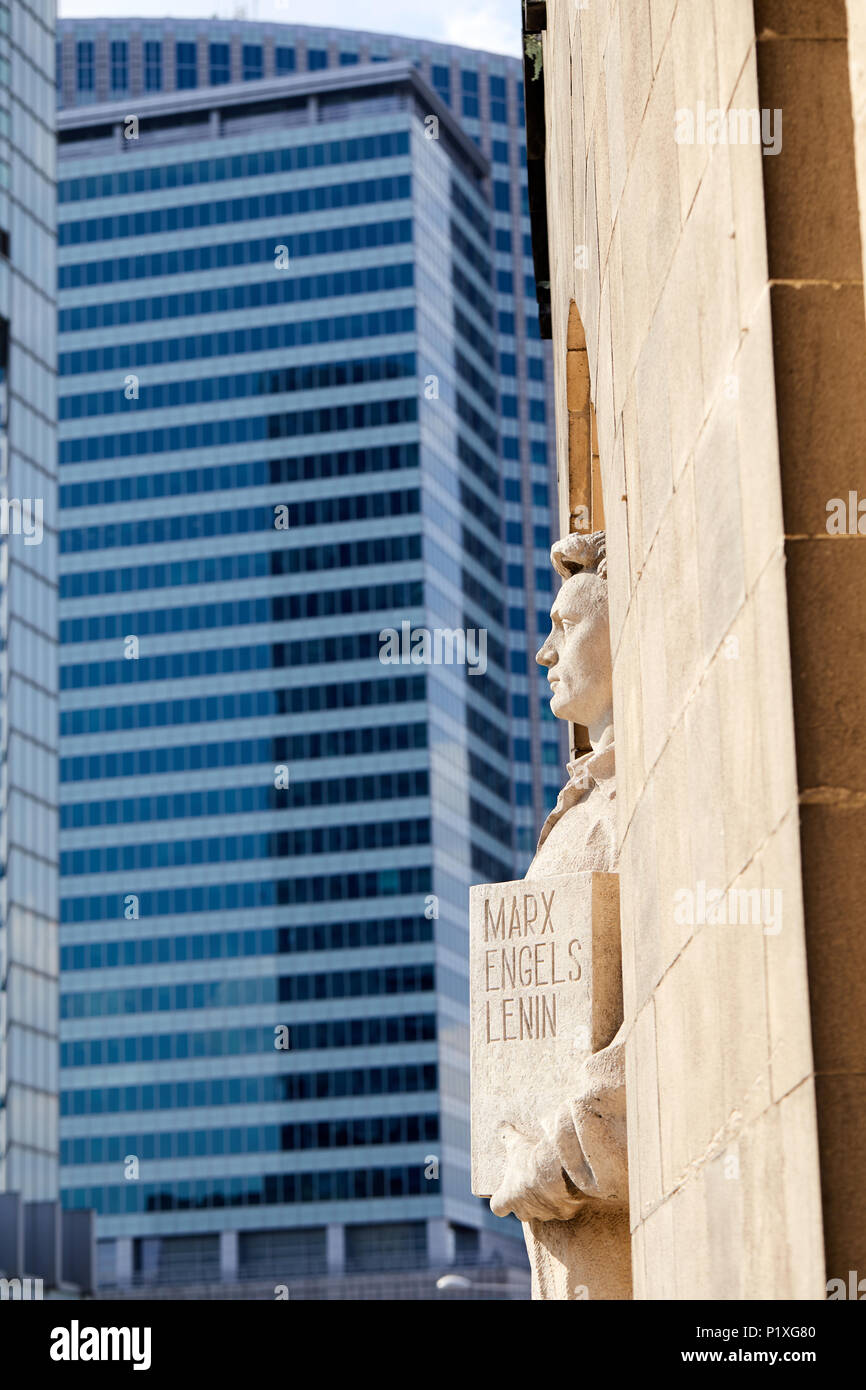 Warsaw, Poland. A statue of a soviet-era worker, holding a tablet ...