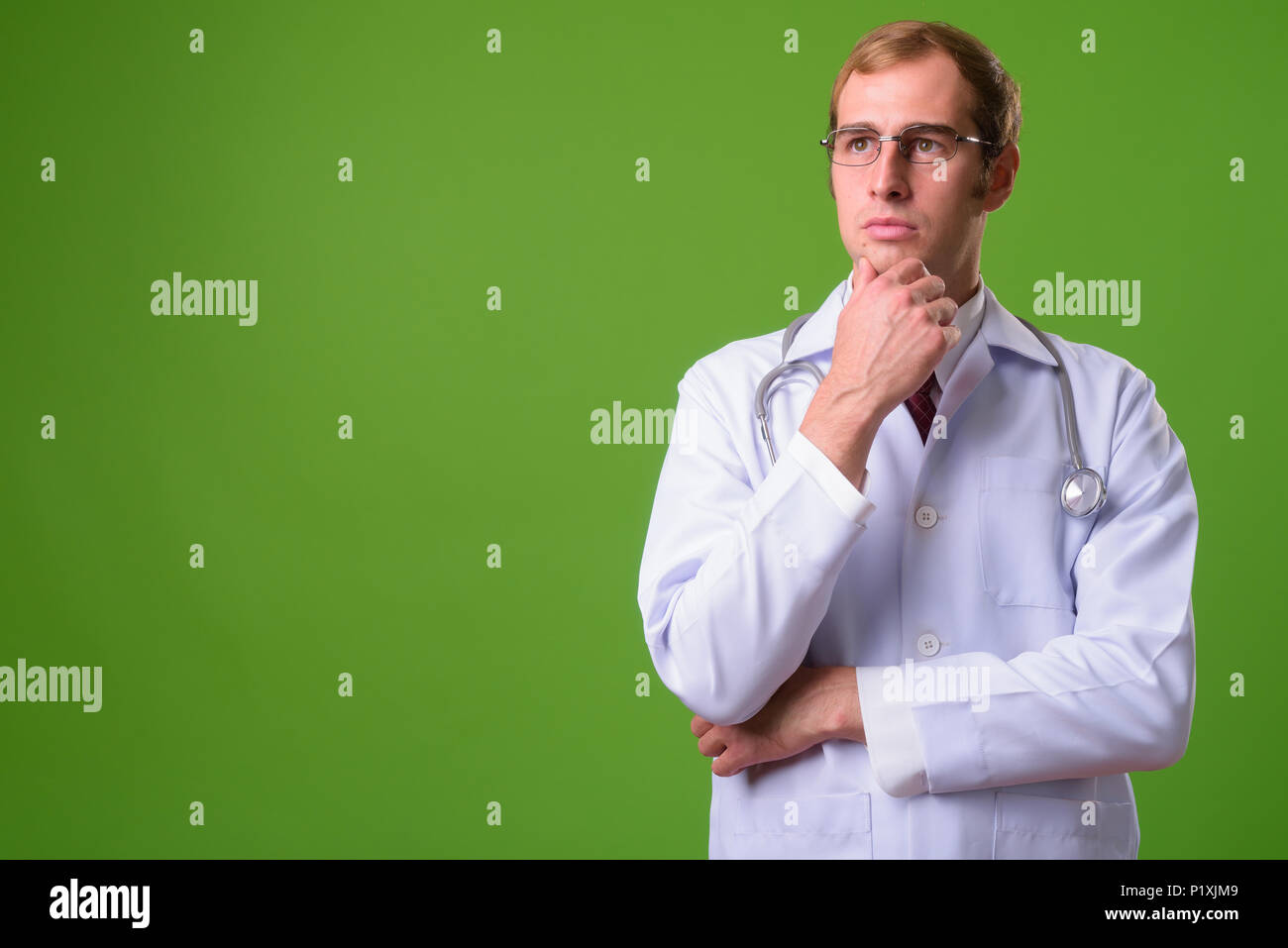 Young doctor thinking hi-res stock photography and images - Alamy